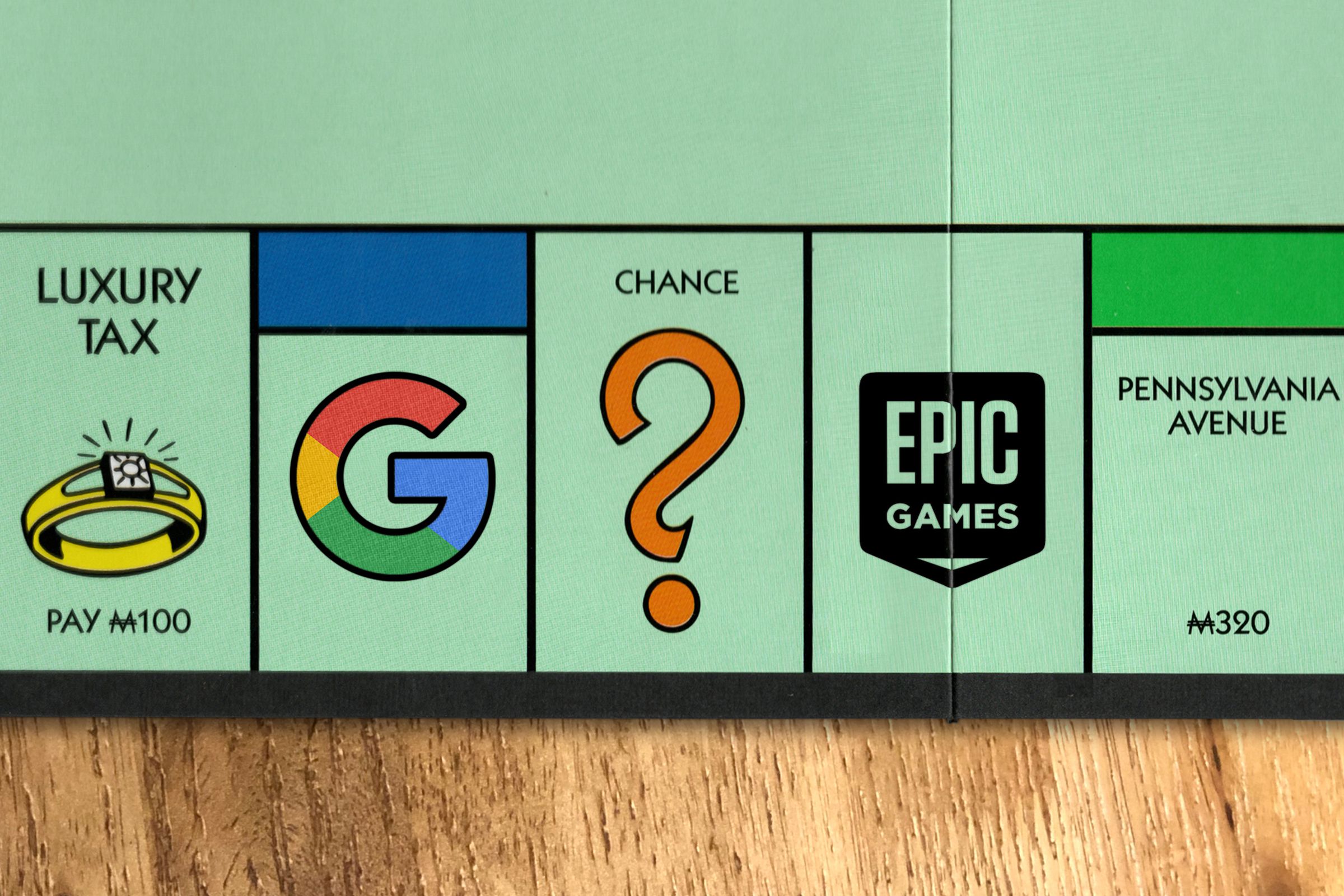 The Google logo and the Epic Games logo photoshopped onto a Monopoly board.