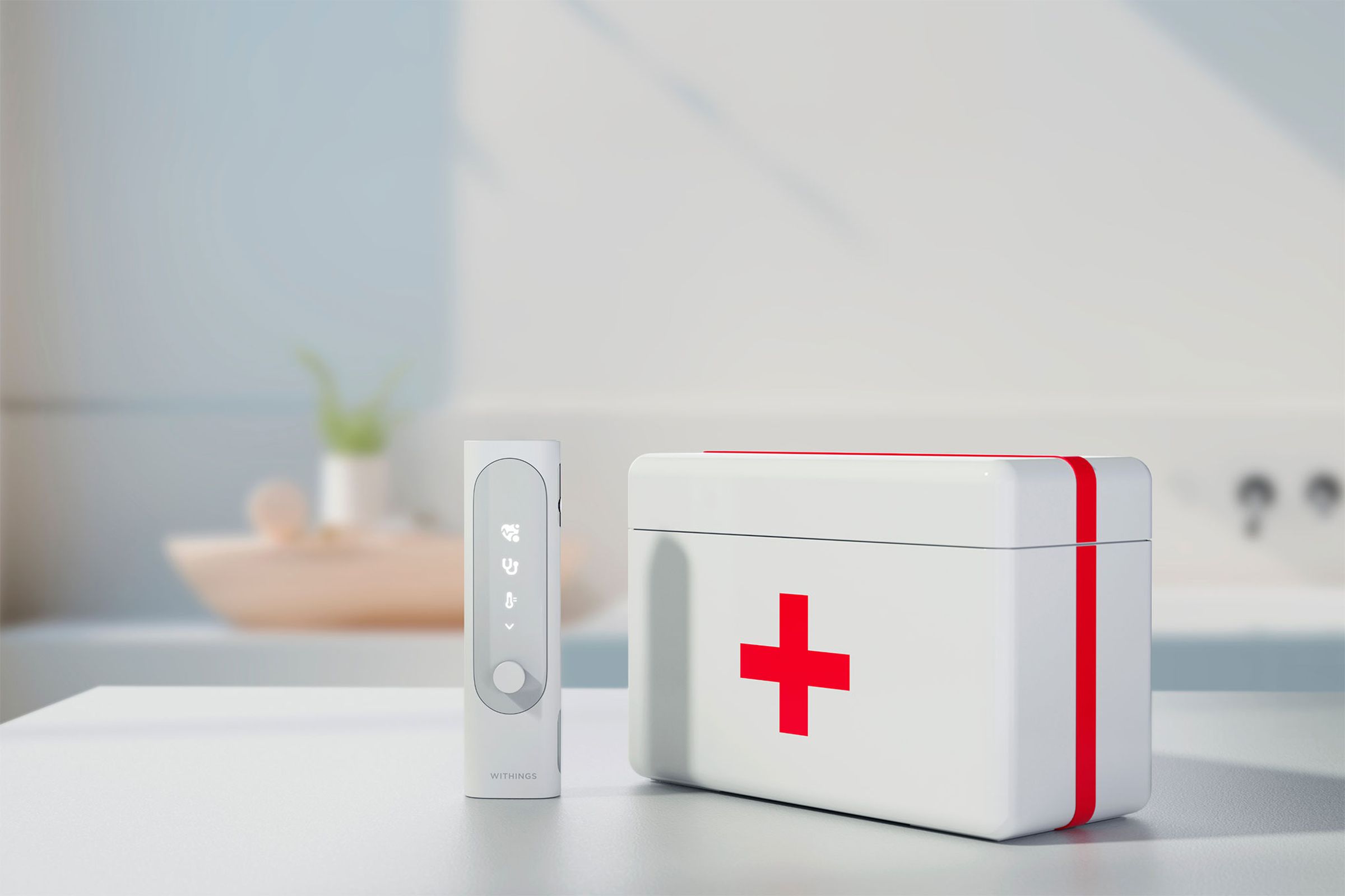 Withings BeamO next to a first aid kit.