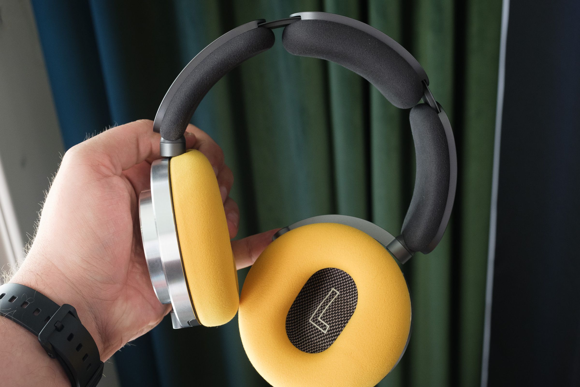 A hands-on photo of Dyson’s OnTrac noise-canceling headphones.