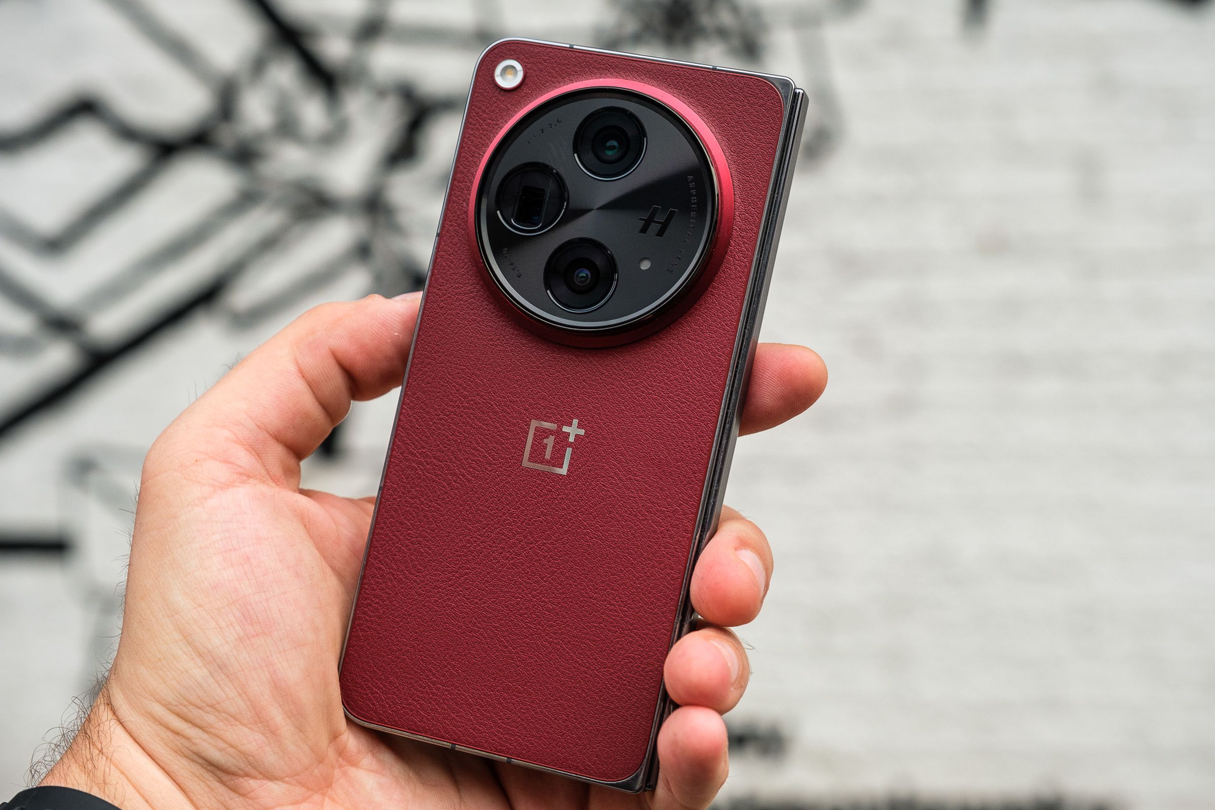 A photo of the OnePlus Open Apex Edition in crimson red.