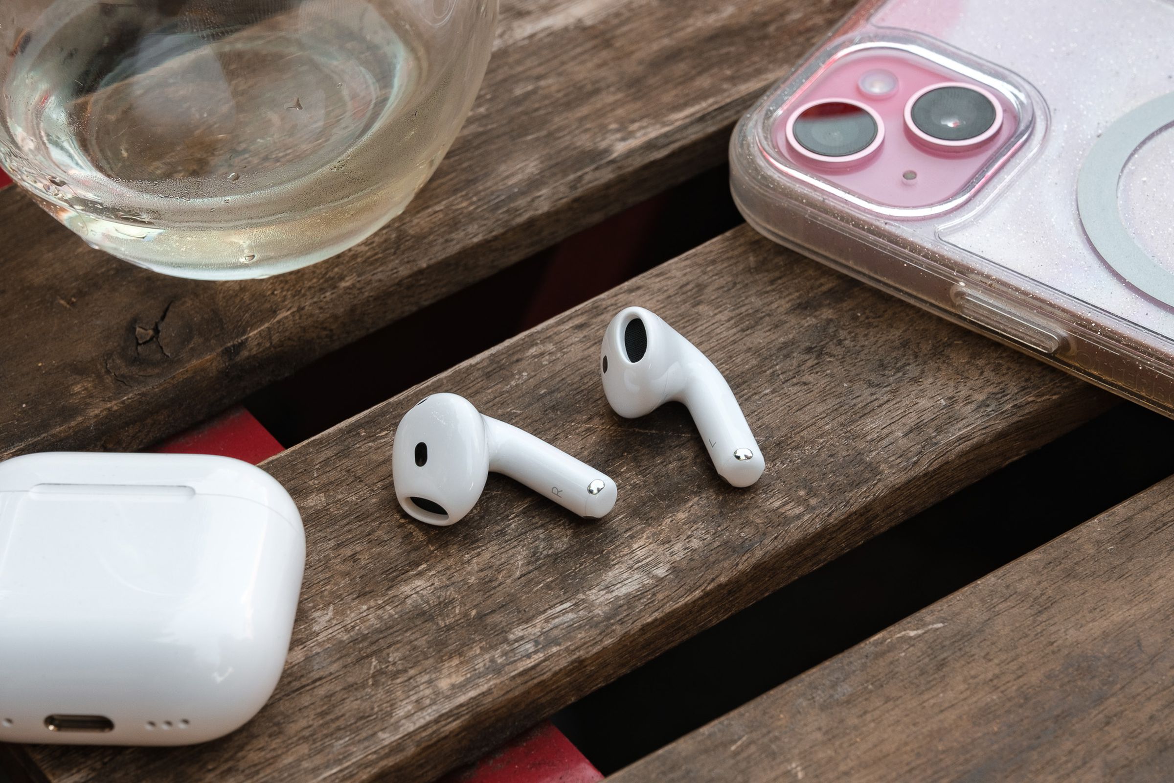 A hands-on photo of Apple’s AirPods 4 wireless earbuds.