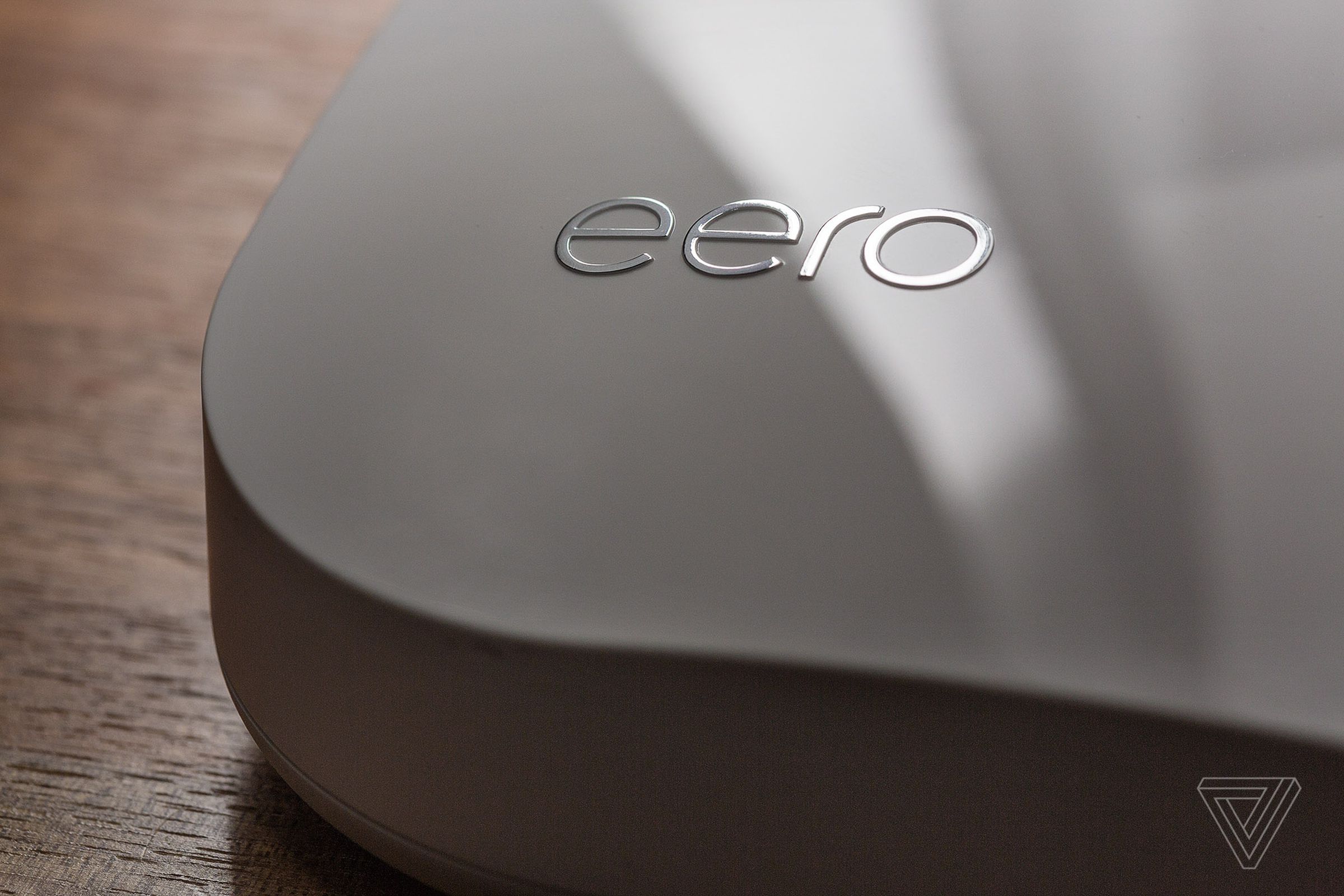 A close-up of an Eero Wi-Fi router.