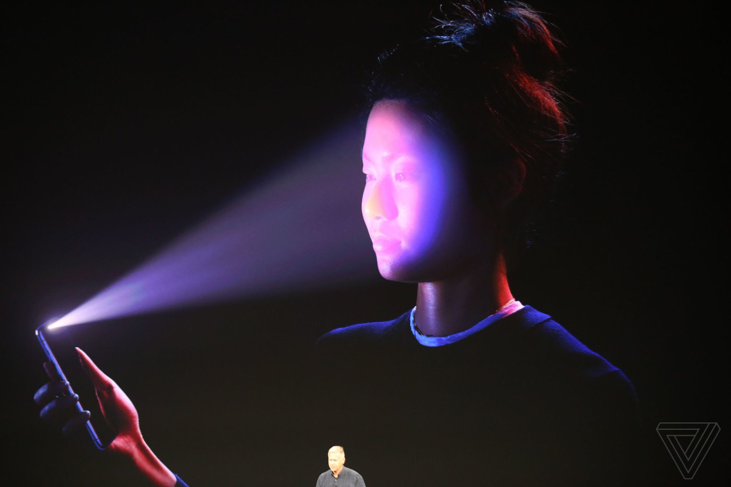 A woman using Face ID