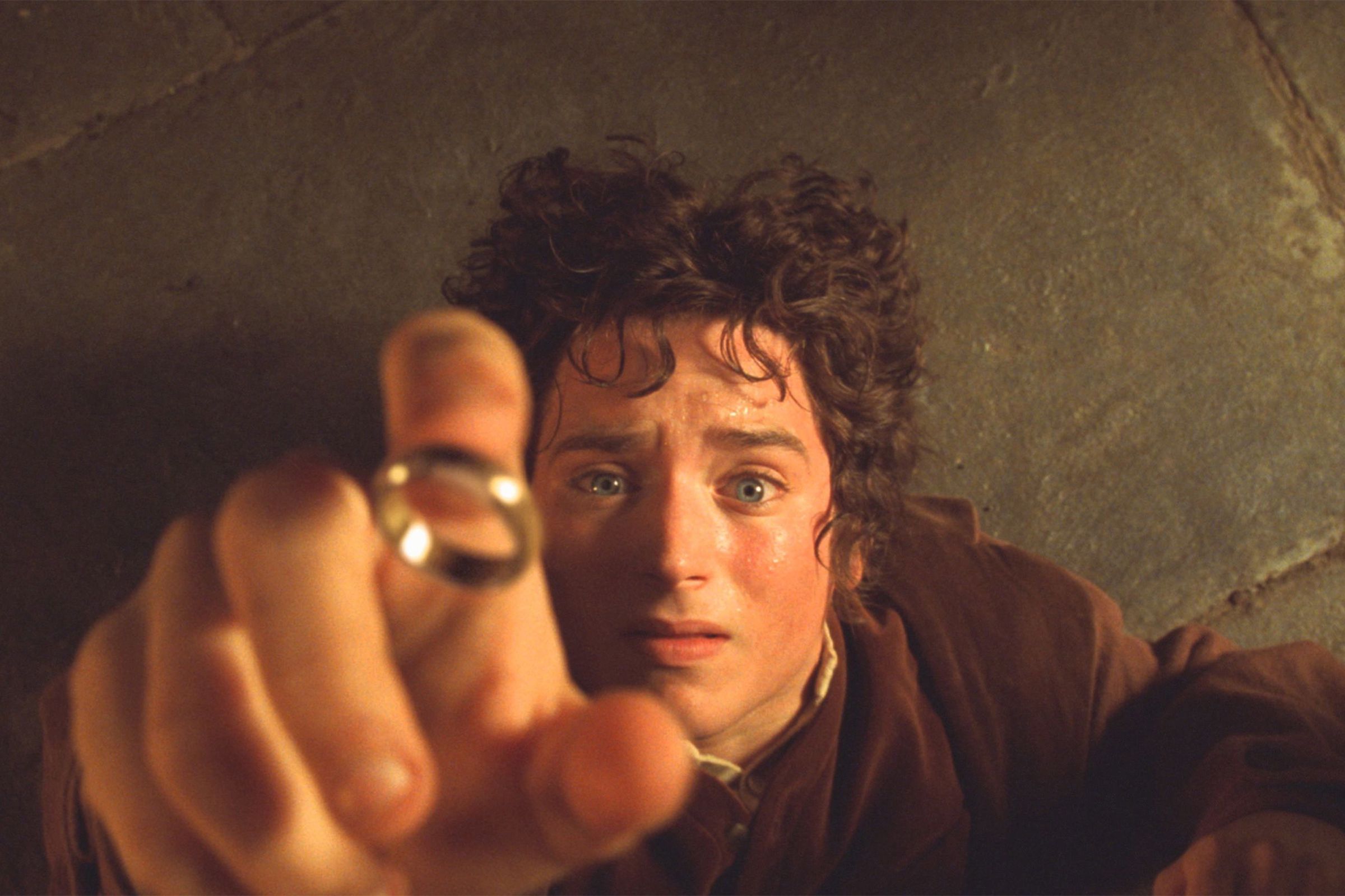 Frodo, played by Elijah Wood, reaches for the ring.