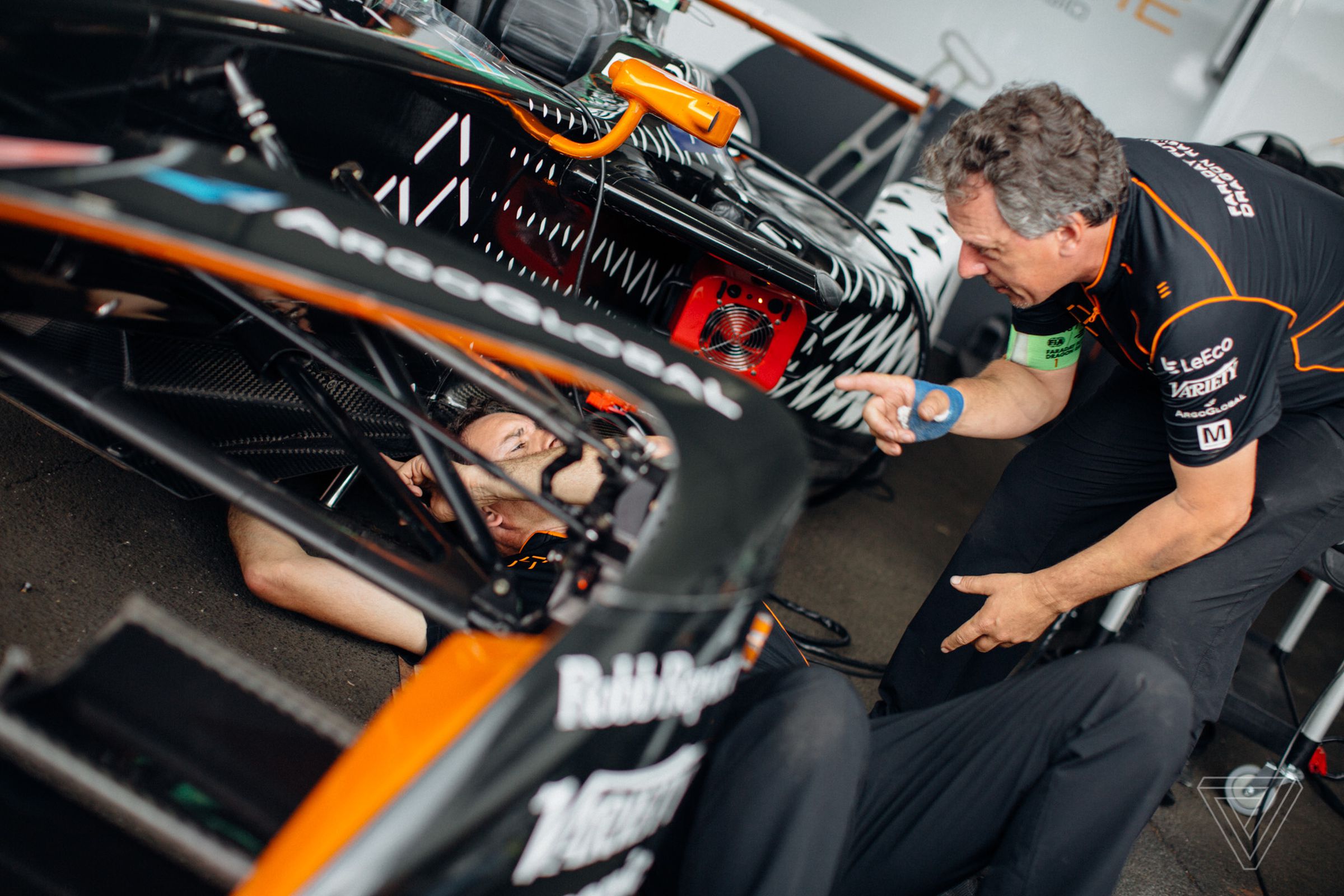 Faraday Future Dragon Racing crew members work on one of the team’s cars. The Silicon Valley startup joined up with the Dragon Racing team ahead of the start of the third season.