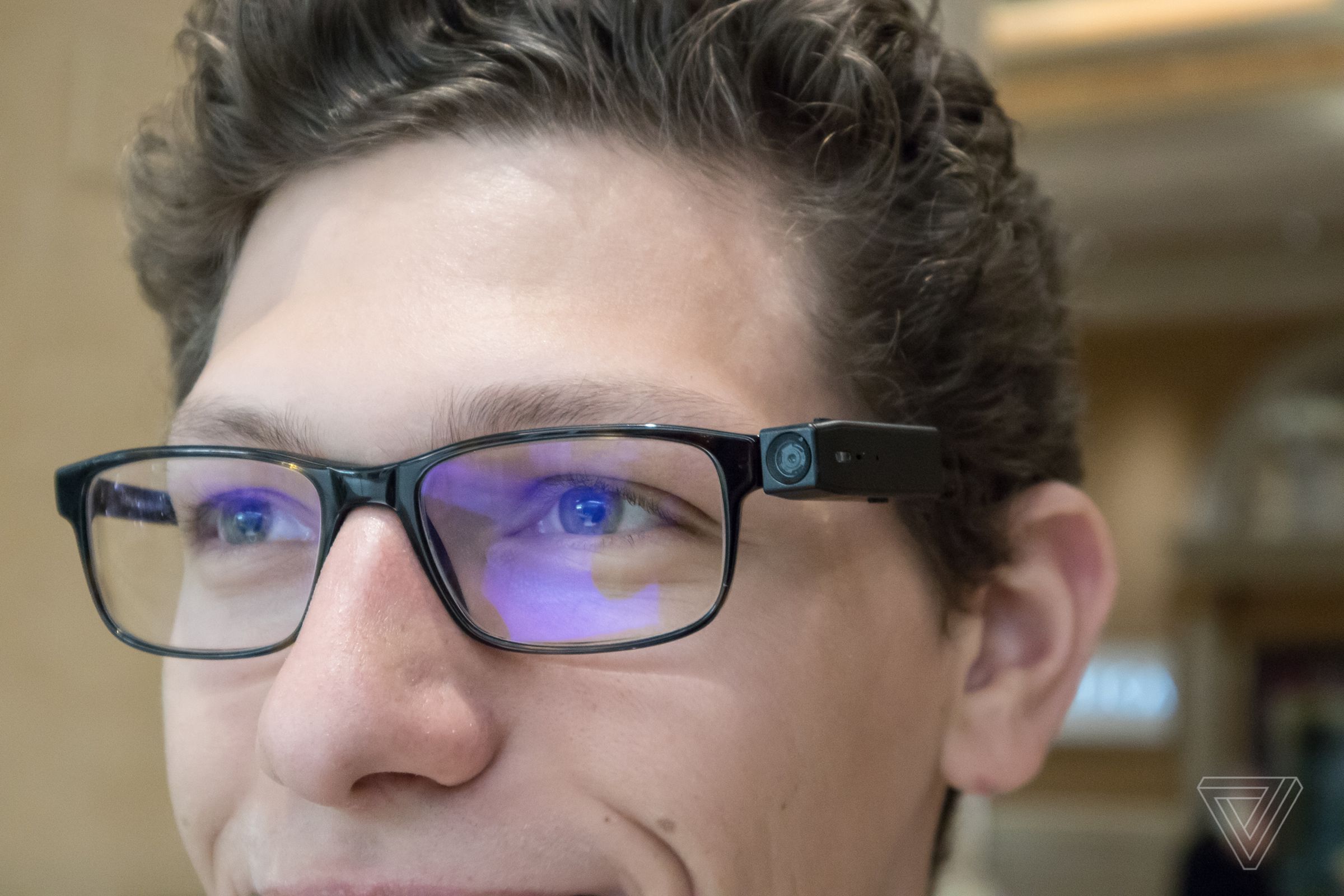 PogoCam attached to a compatible set of glasses frames.