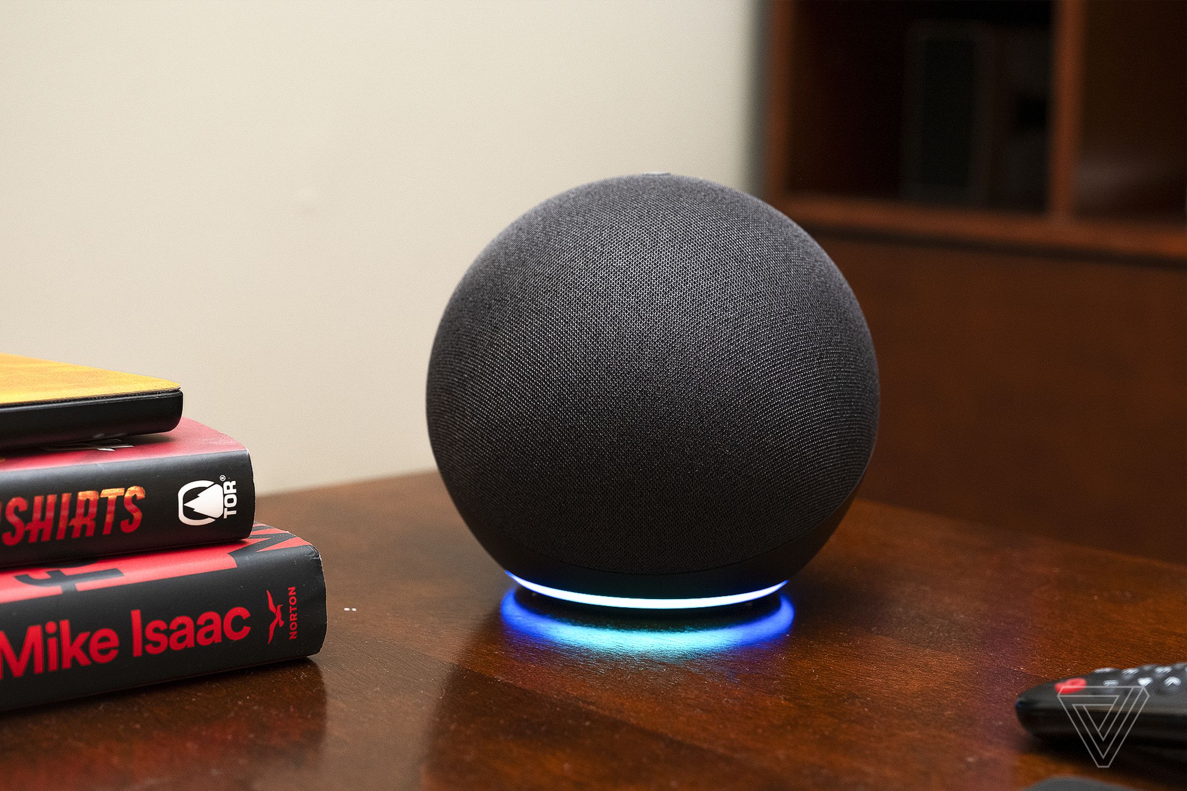 The fourth-gen Echo smart speaker on a wooden desk