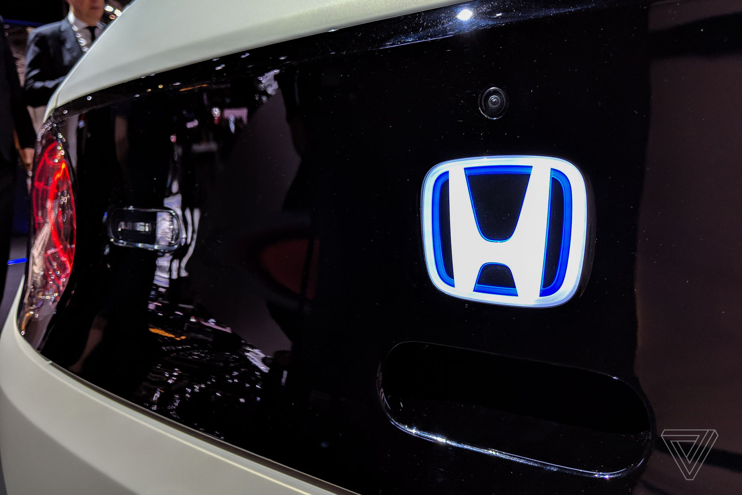 A lit-up Honda logo