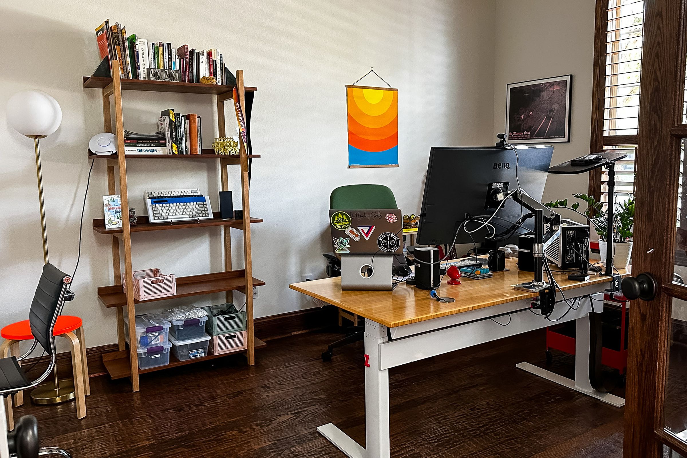 Desk and bookcase, with window at right.