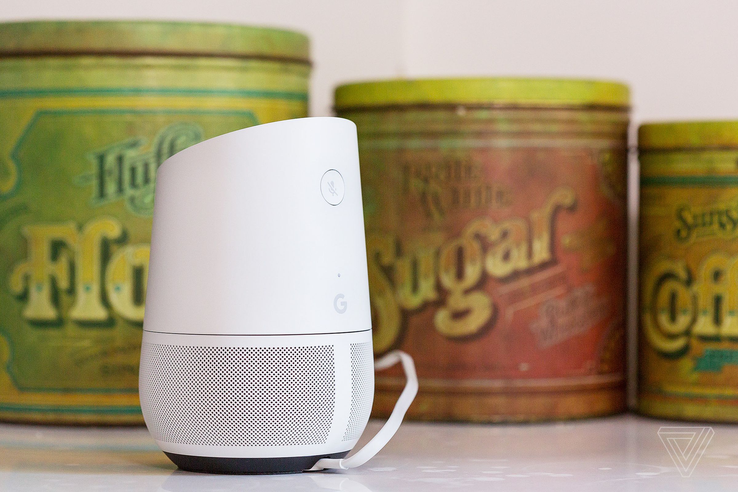 Google Home speaker in front of sugar cans