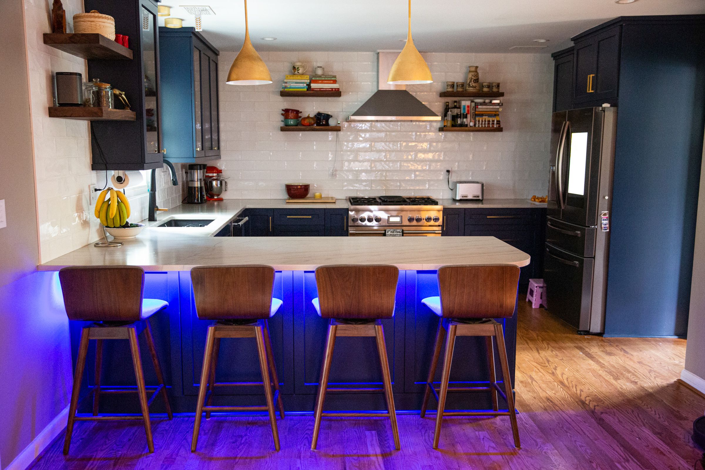 A kitchen island with blue lights