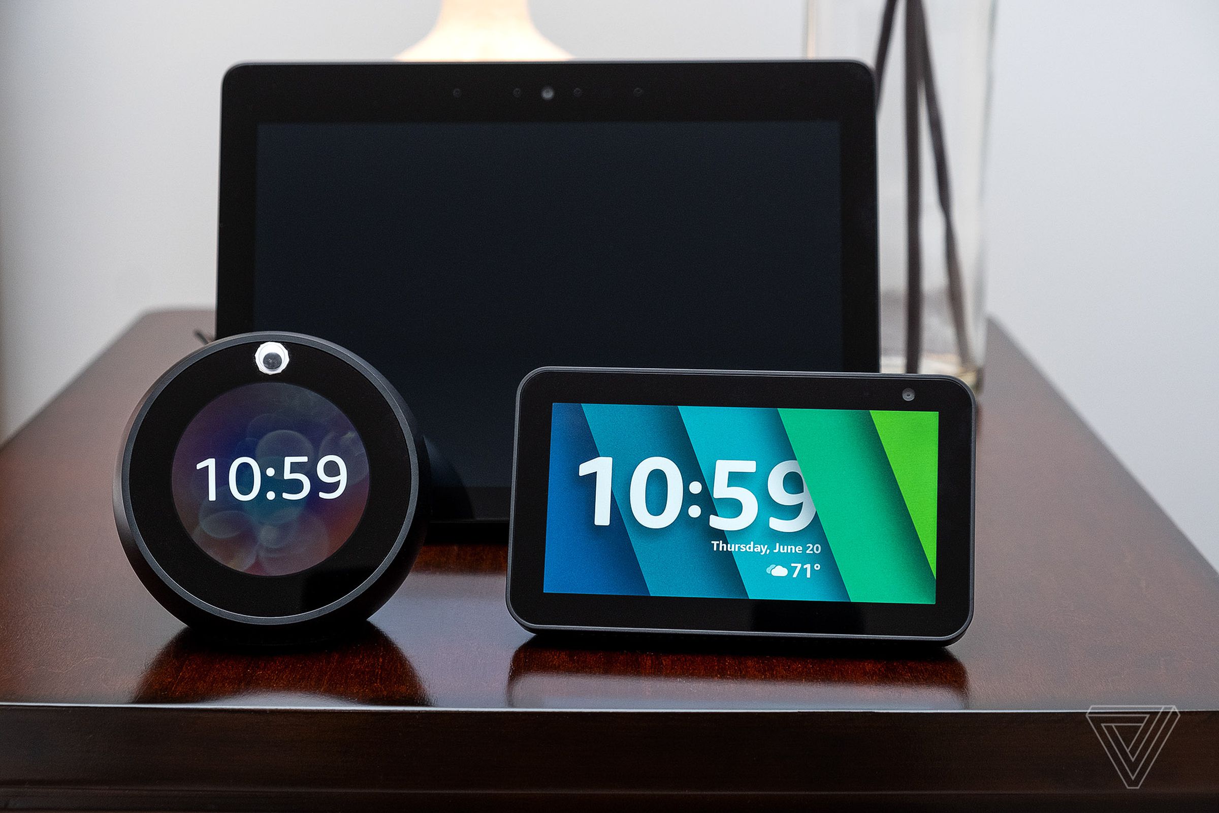 The Echo Show 5 (right) is only slightly larger than the Echo Spot (left) but considerably smaller than the Echo Show (in rear).