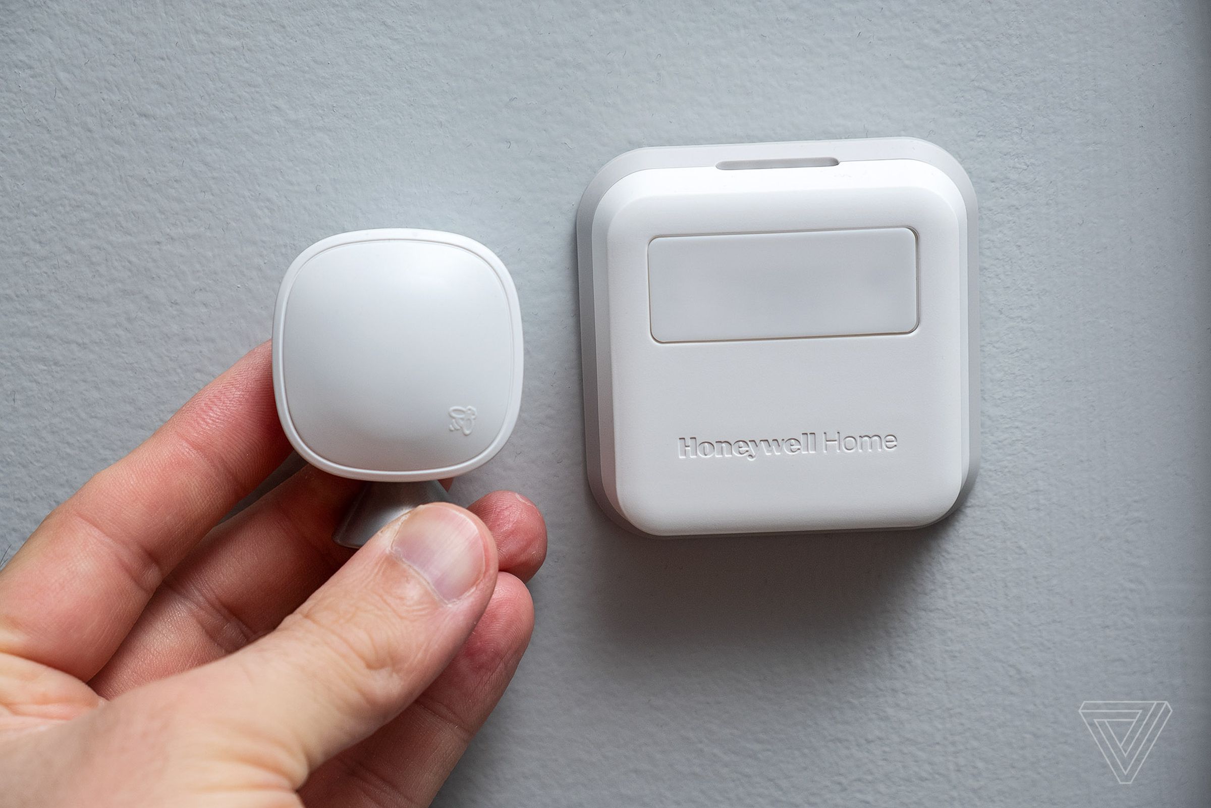 Ecobee remote sensor (left), T9 sensor (right). Unlike the Ecobee, the T9 sensor can read both temperature and humidity, and it runs on standard AAA batteries, but it’s much larger.