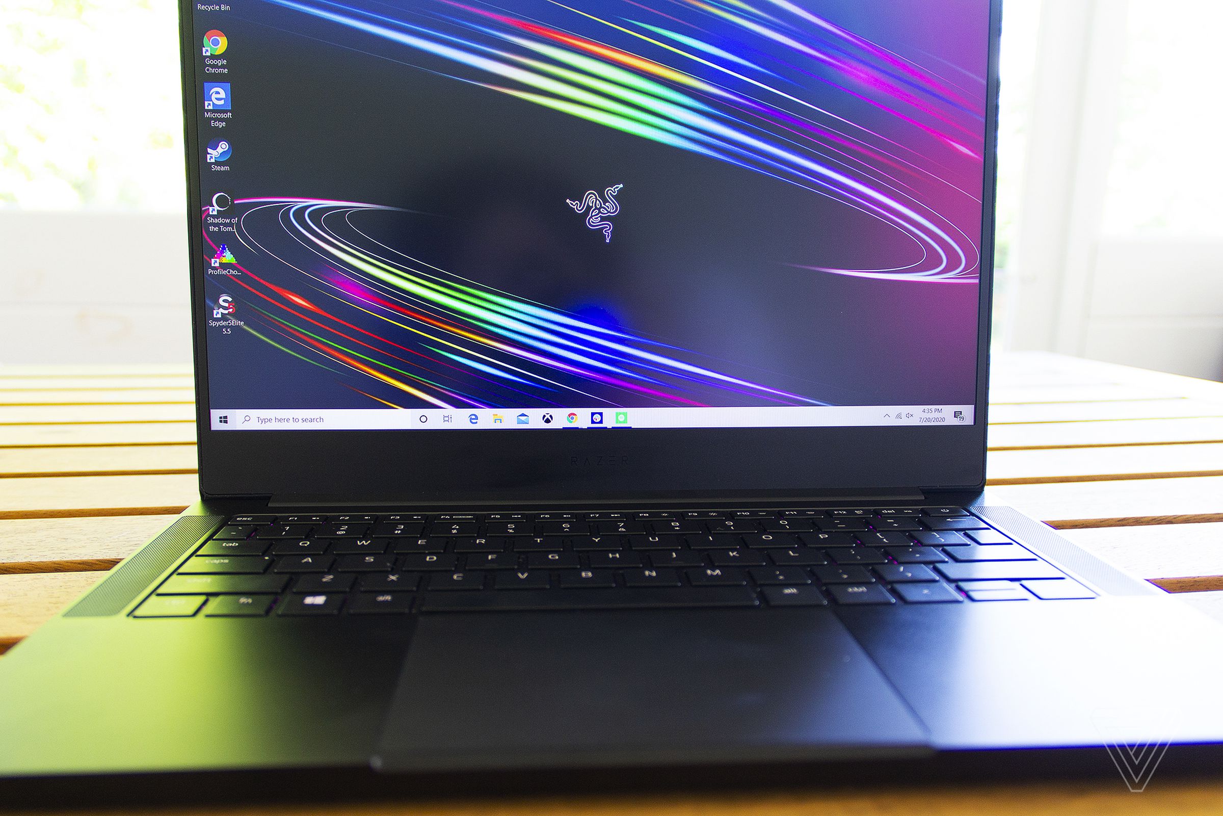 Close-up of the Razer Blade Stealth 13 with the Razer logo on the bottom bezel.