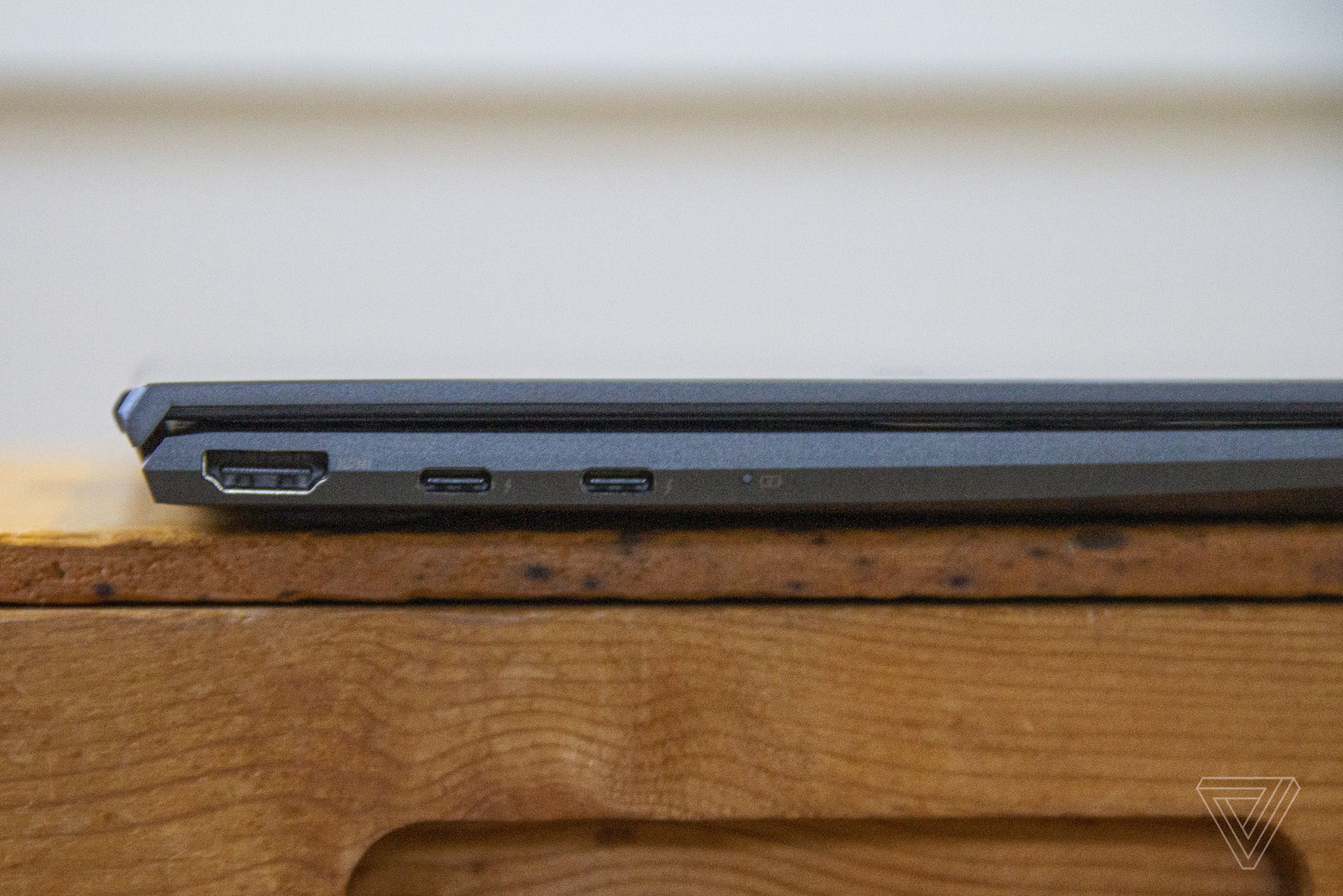 The Asus Zenbook 14 closed from the left side.