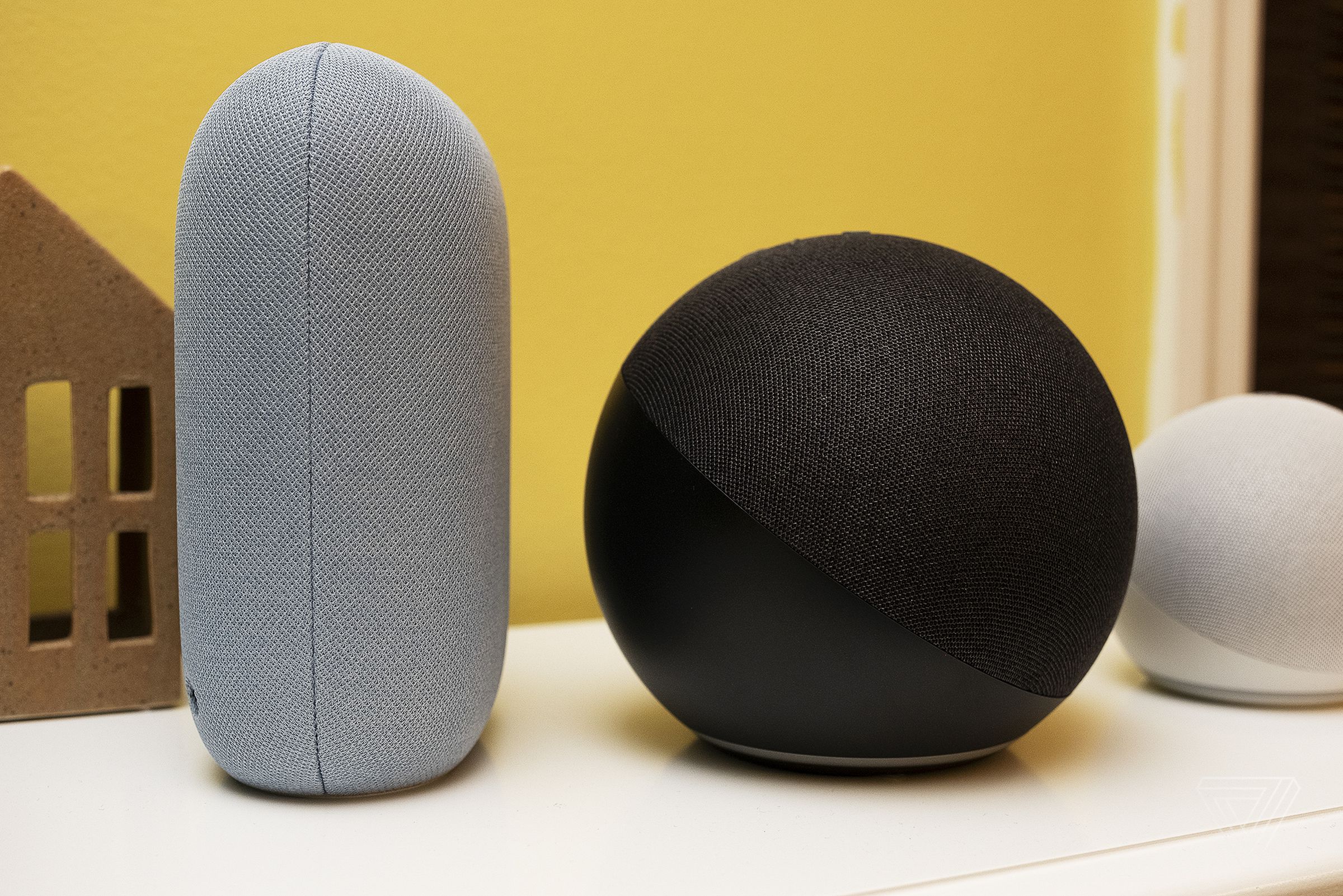 From the side, you can see how much deeper the Echo is compared to the Nest Audio
