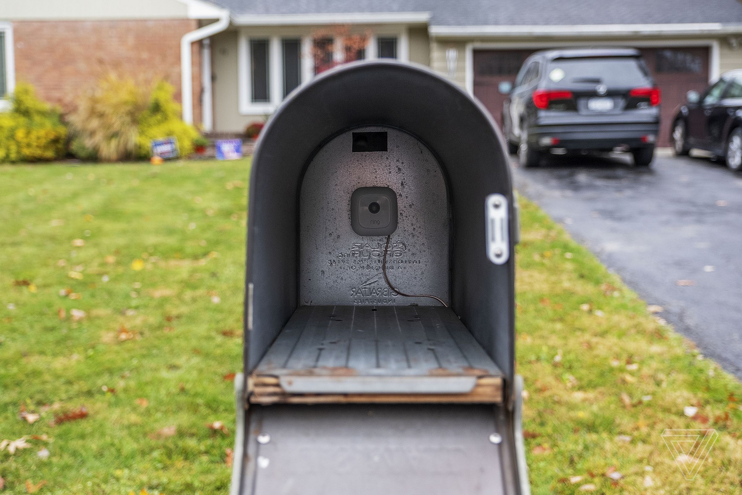 Double-sided tape holds the motion sensor inside the box.