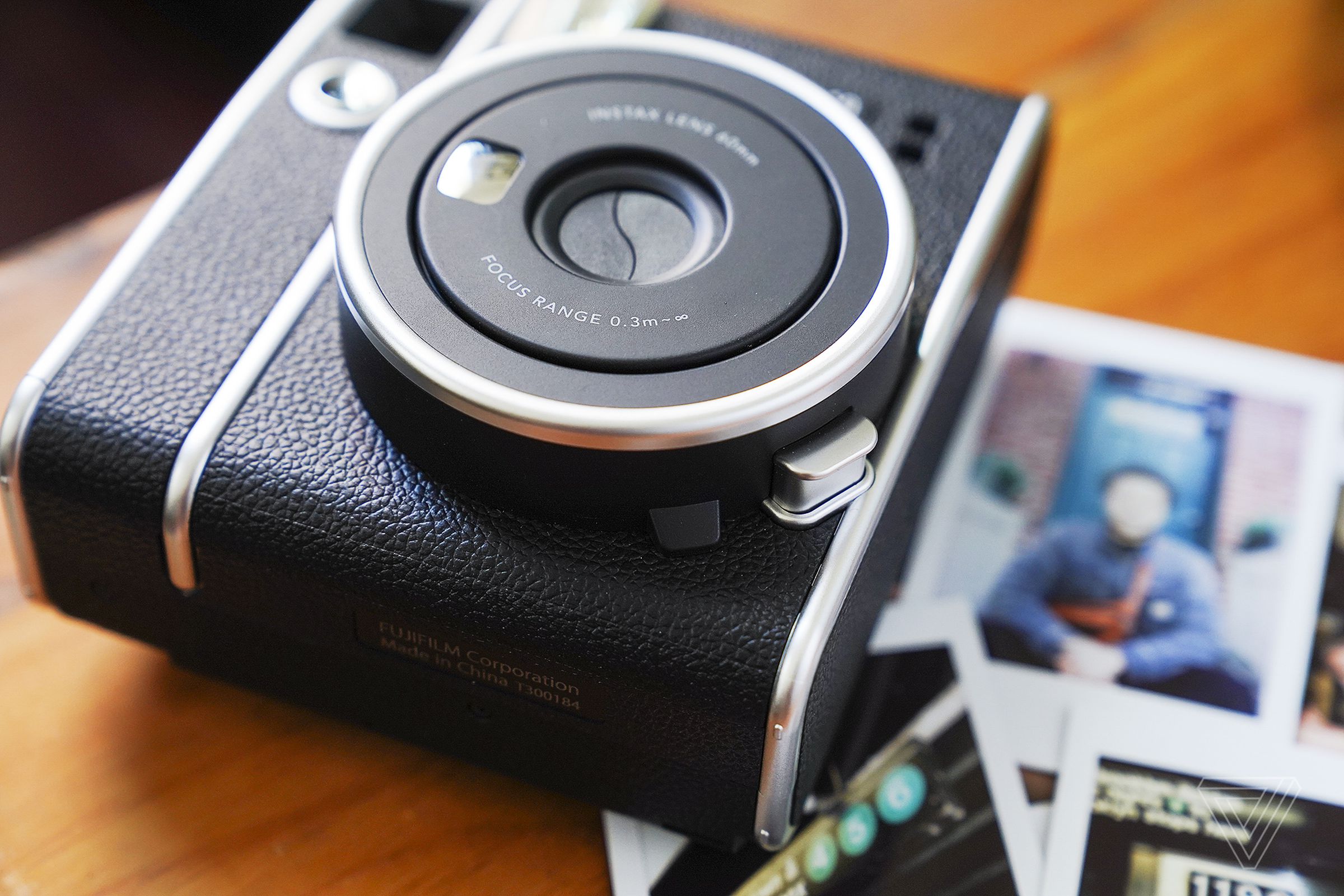 To turn on the Instax Mini 40, you push the silver button under the lens.