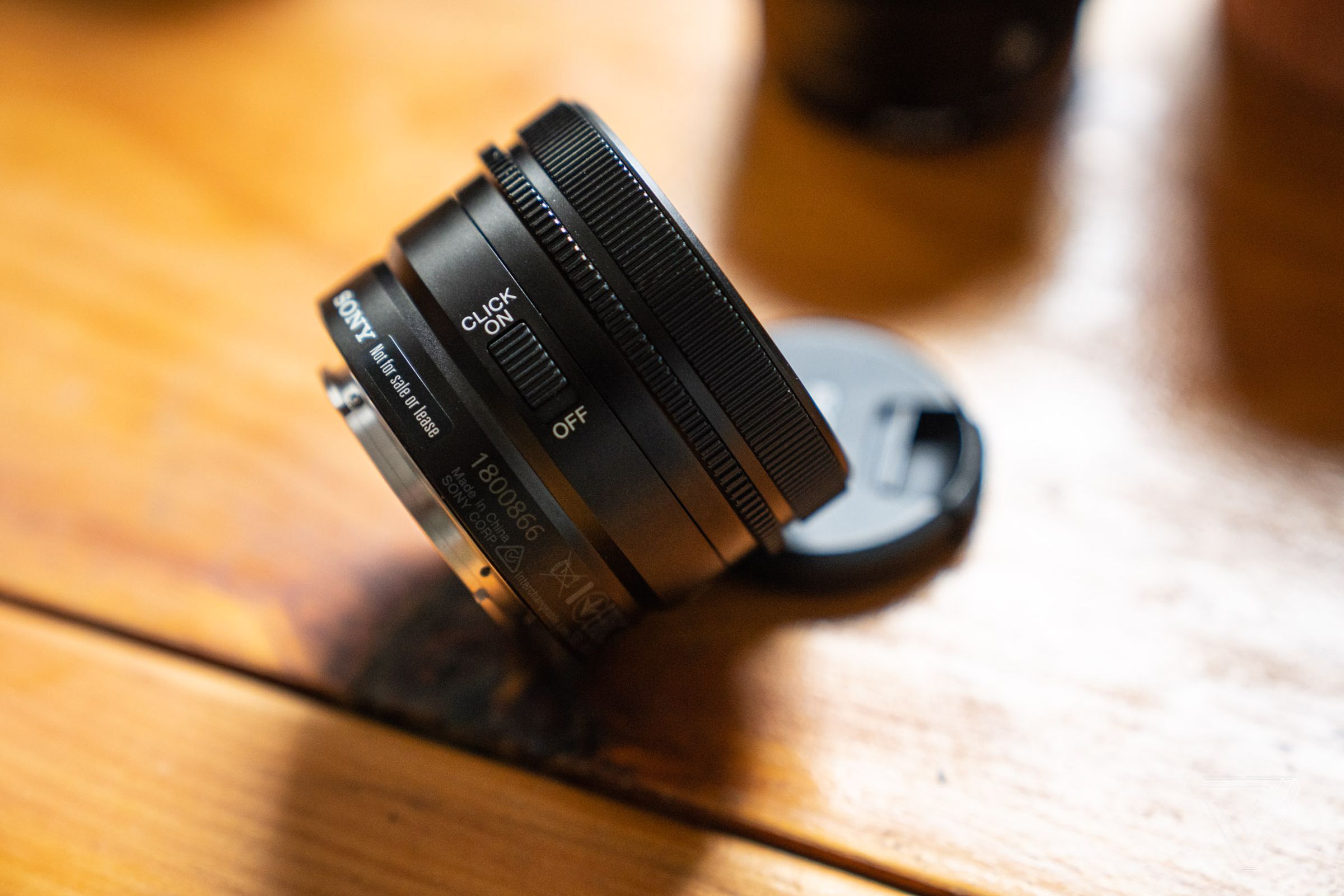 There is an aperture click switch on the right-hand side of each lens.