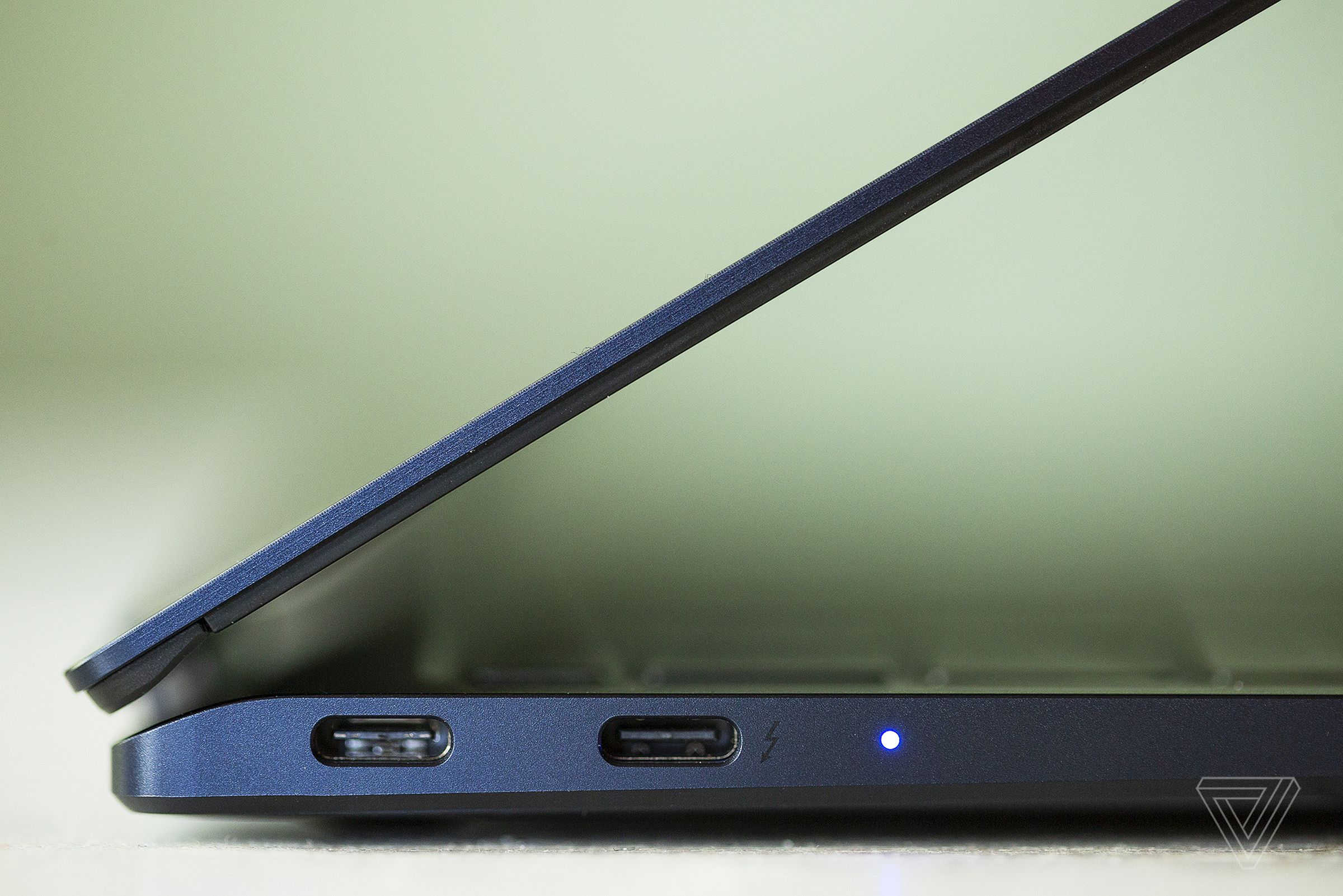 The left side of the Samsung Galaxy Book Pro 360 (15-inch). The battery indicator light is on.