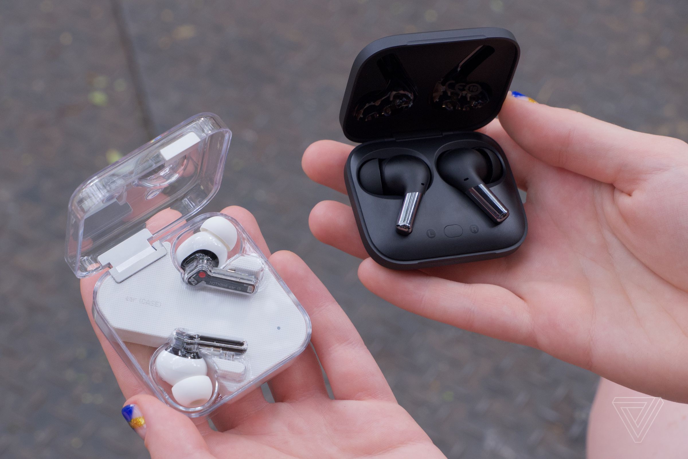 The OnePlus Buds are $50 more expensive than the Nothing Ear 1s (left).