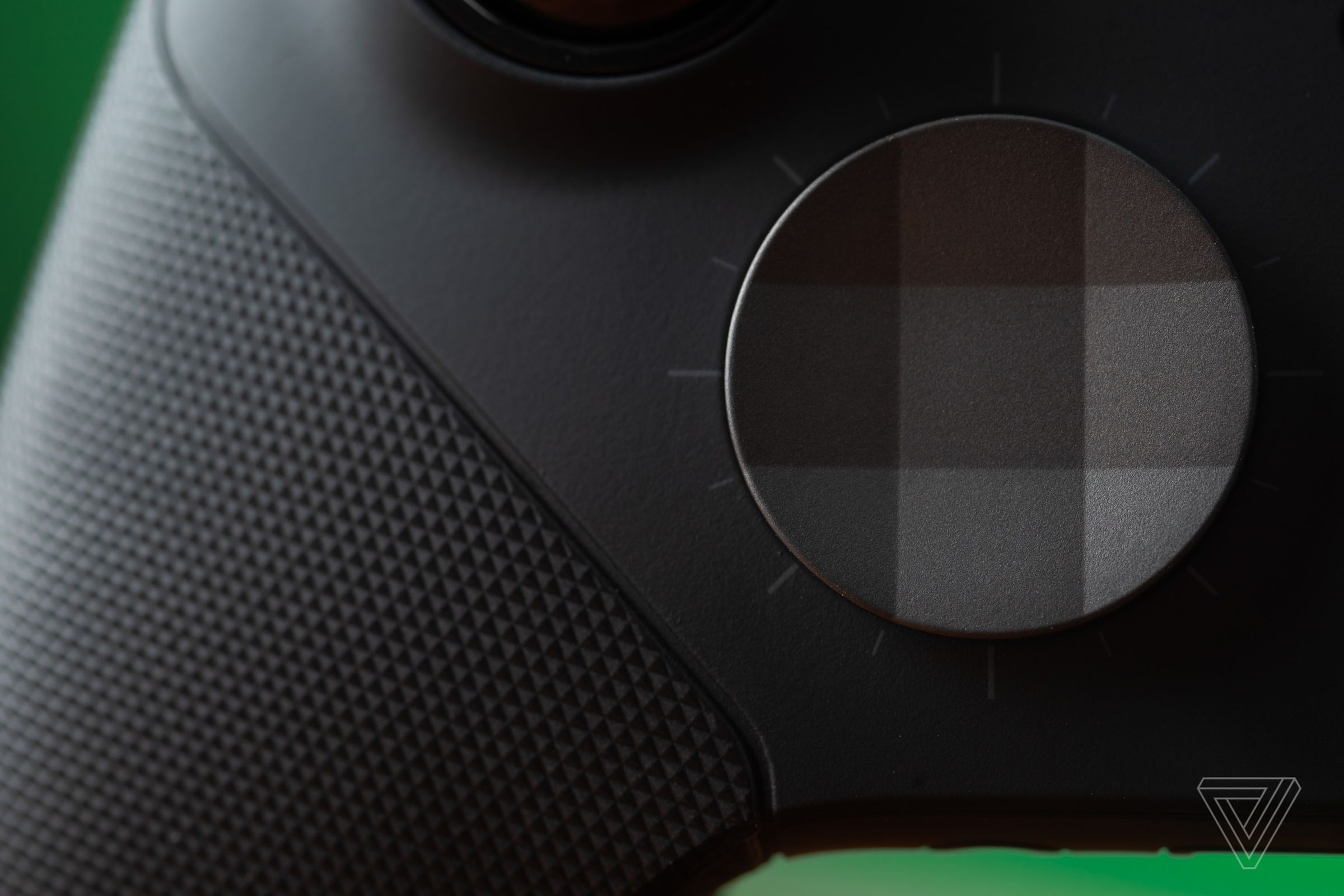 A macro closeup of the dish-shaped metal D-pad on the Xbox Elite Wireless Controller Series 2.