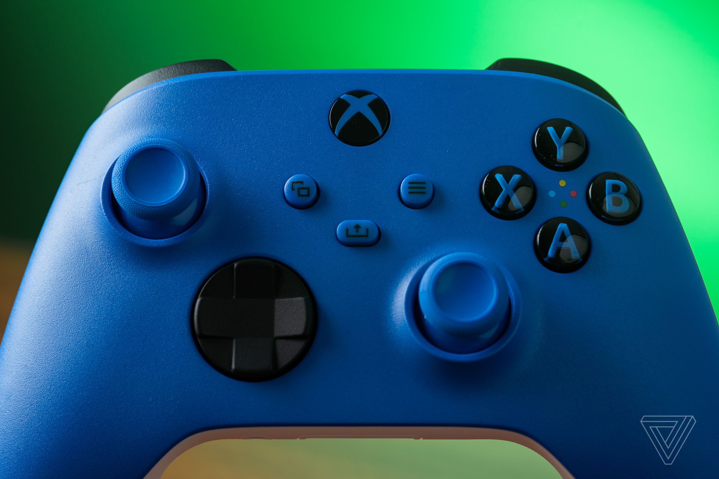 A closeup photo of the Xbox Wireless Controller in blue, showing that the buttons are color-matched to the controller.