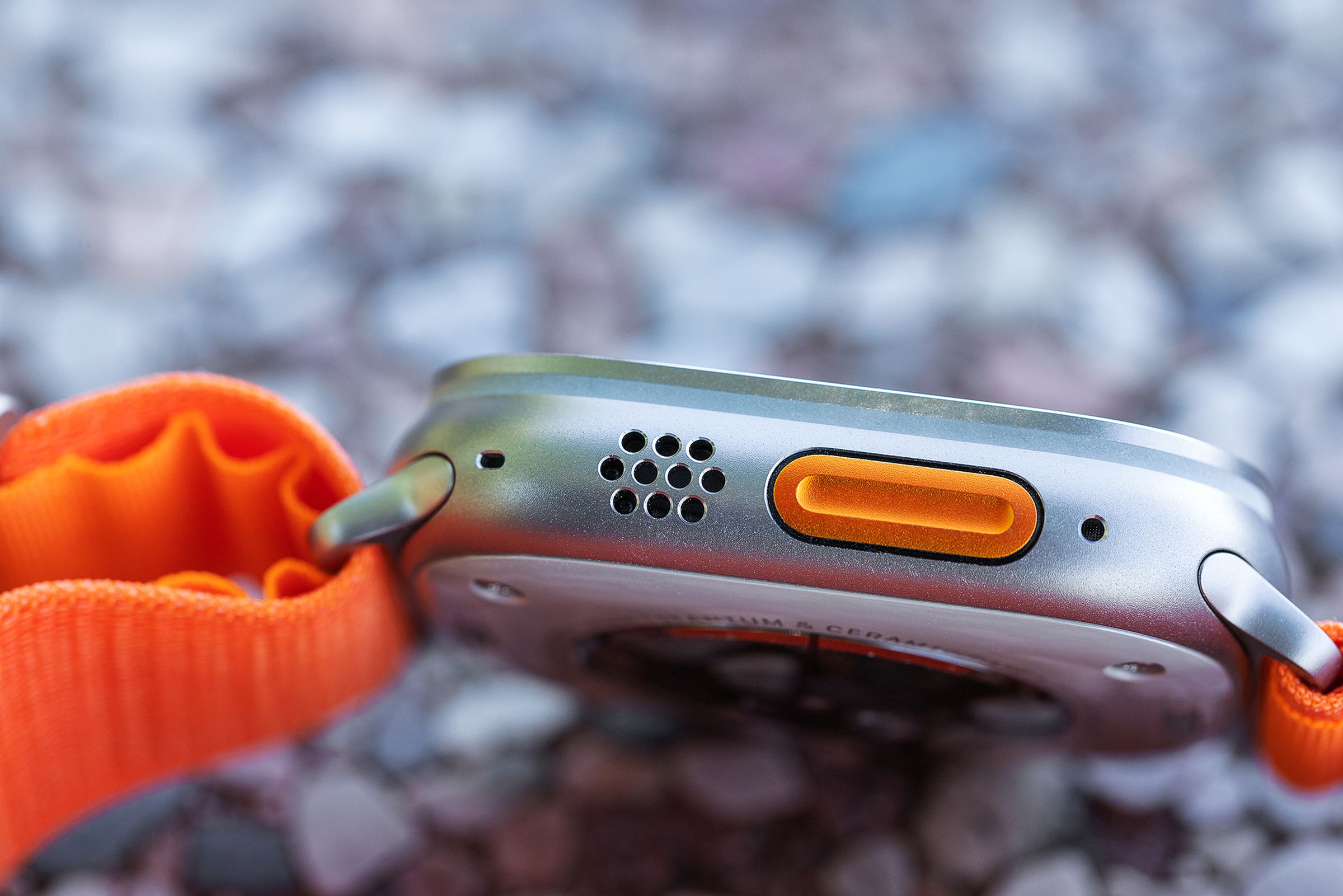 Close-up of the Action button, speakers, and microphones on the Apple Watch Ultra