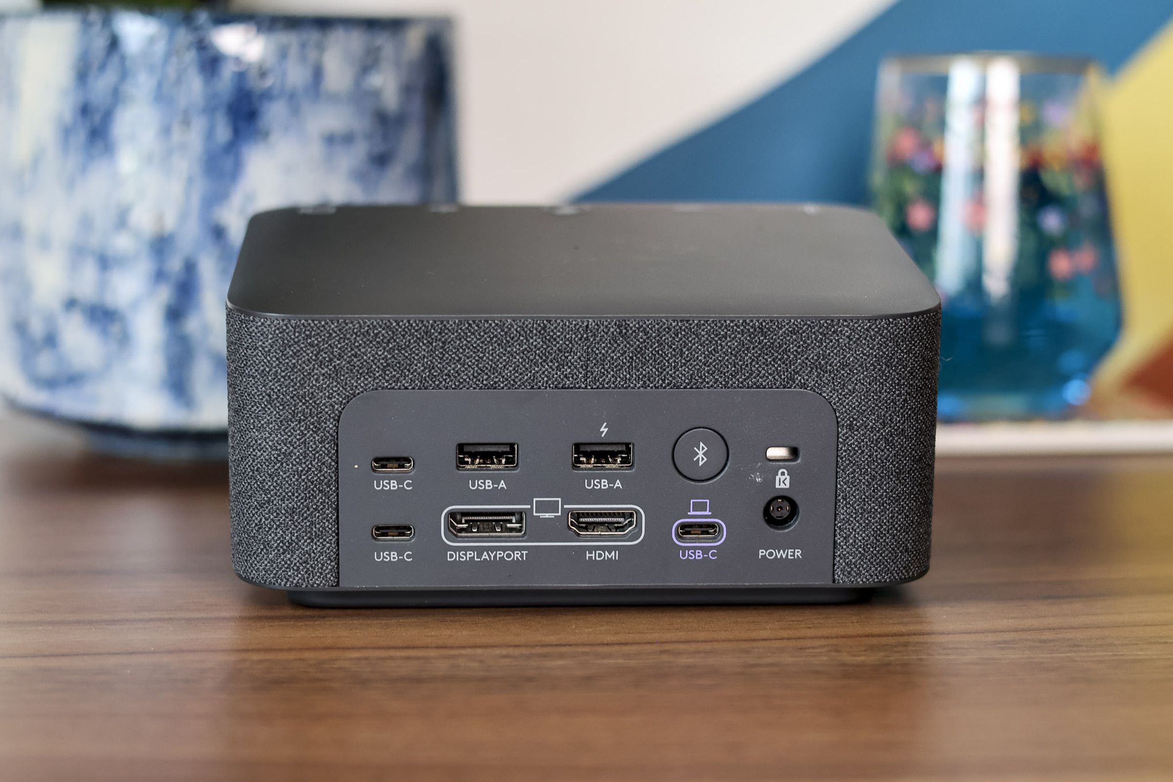 A photograph of the Logitech Logi Dock as viewed from the rear, displaying its various ports and connections.