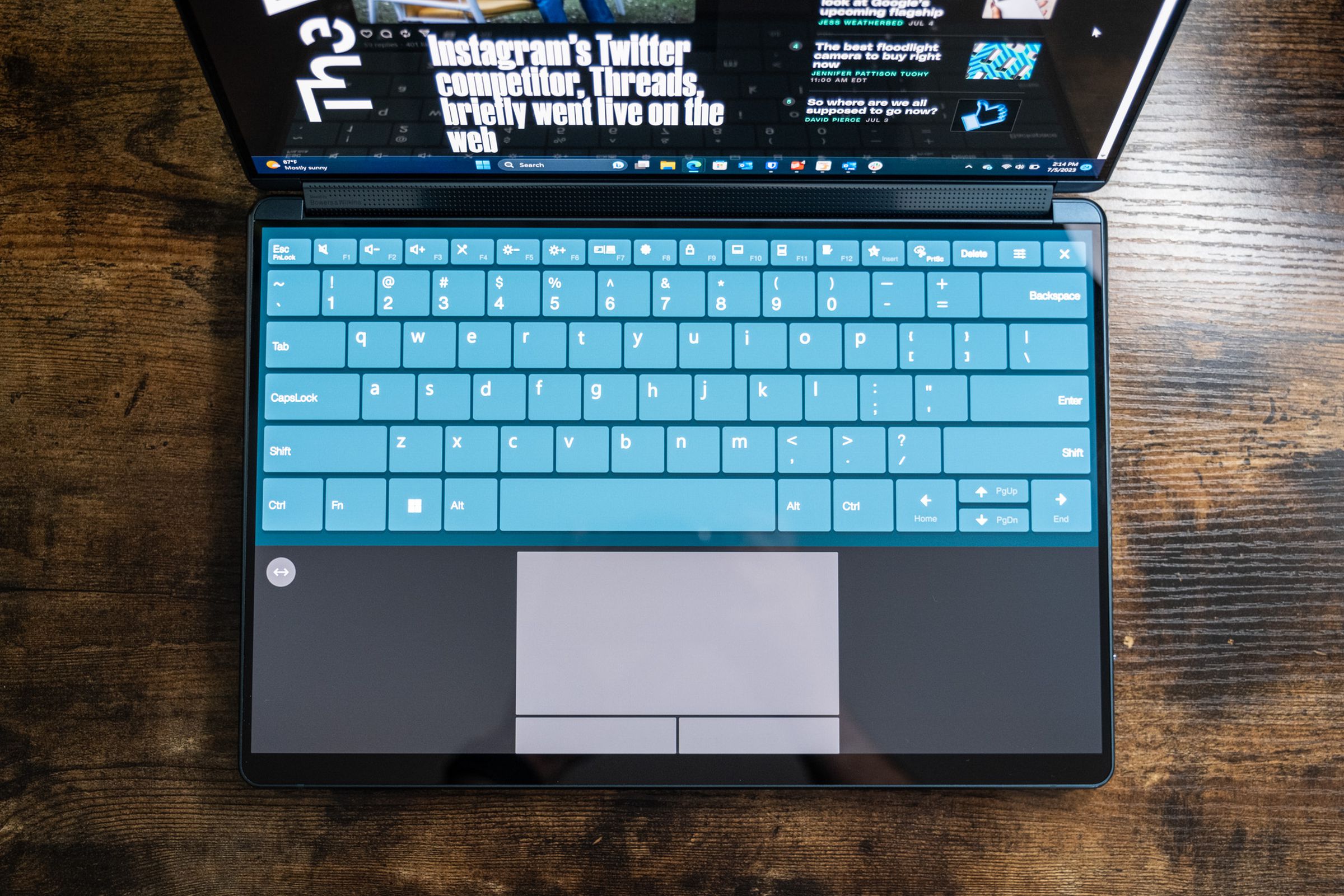 A top-down shot of the virtual keyboard and trackpad on the Lenovo Yoga Book 9i.