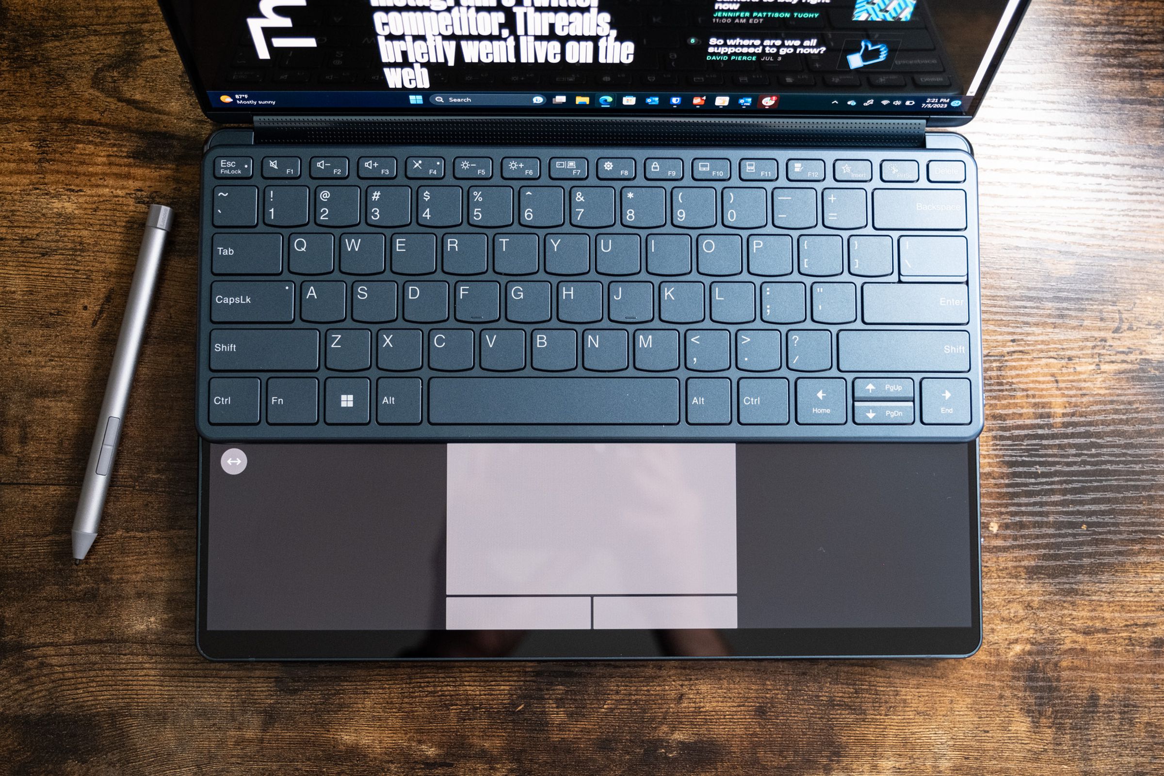 The Lenovo Yoga Book 9i with its Bluetooth keyboard on top of the bottom screen.