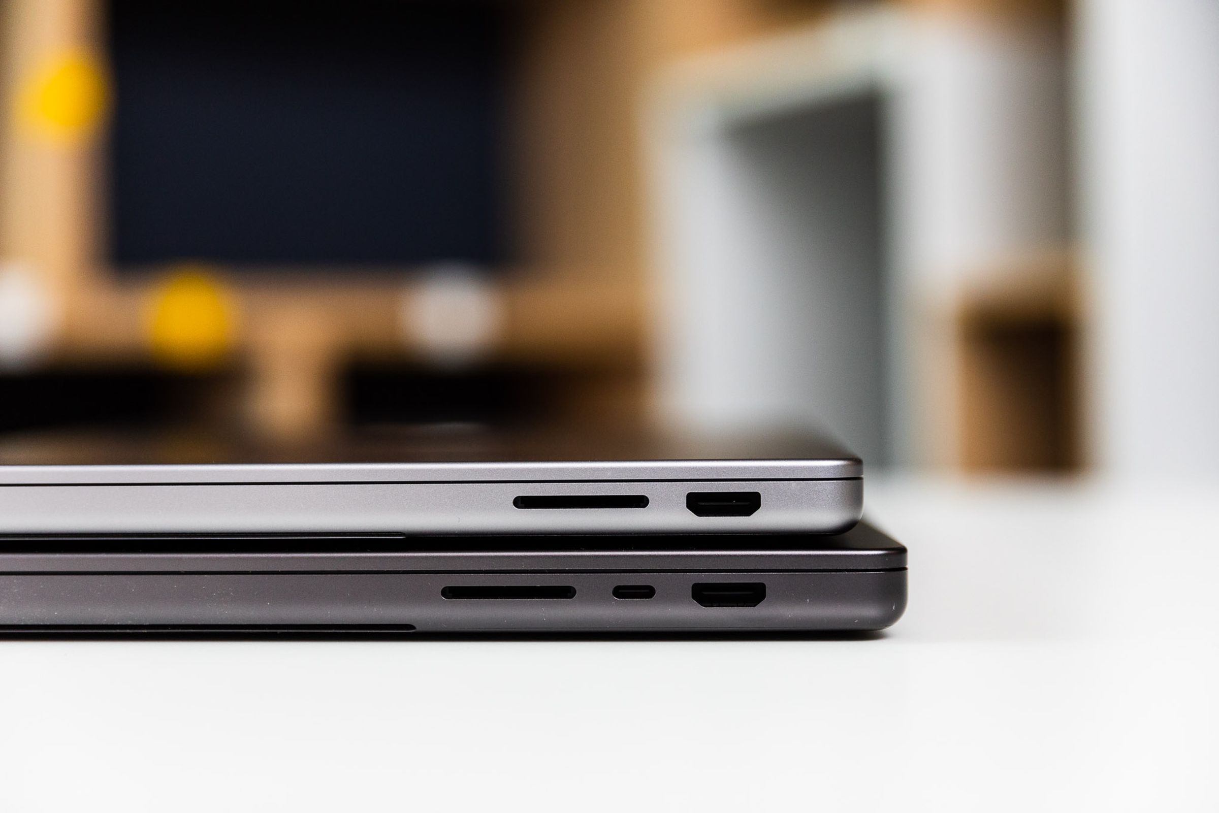 M3 MacBook 14 (top) and M3 Max Macbook 16 (bottom) showing the right side ports.