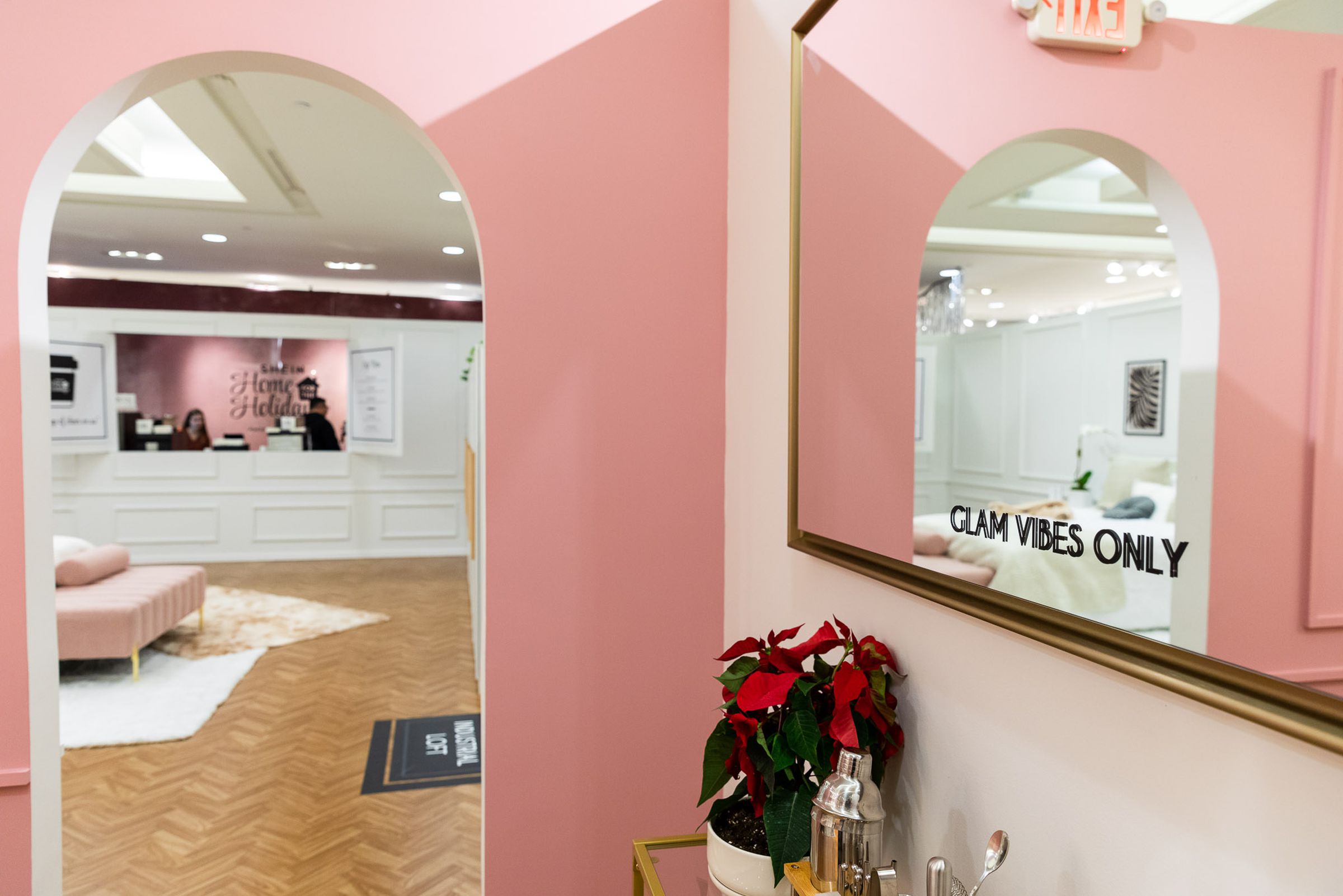 The Shein Times Square event was in a large, staged home constructed inside Forever 21. The walls are pink, with a mirror hanging that reads, “GLAM VIBES ONLY.” 