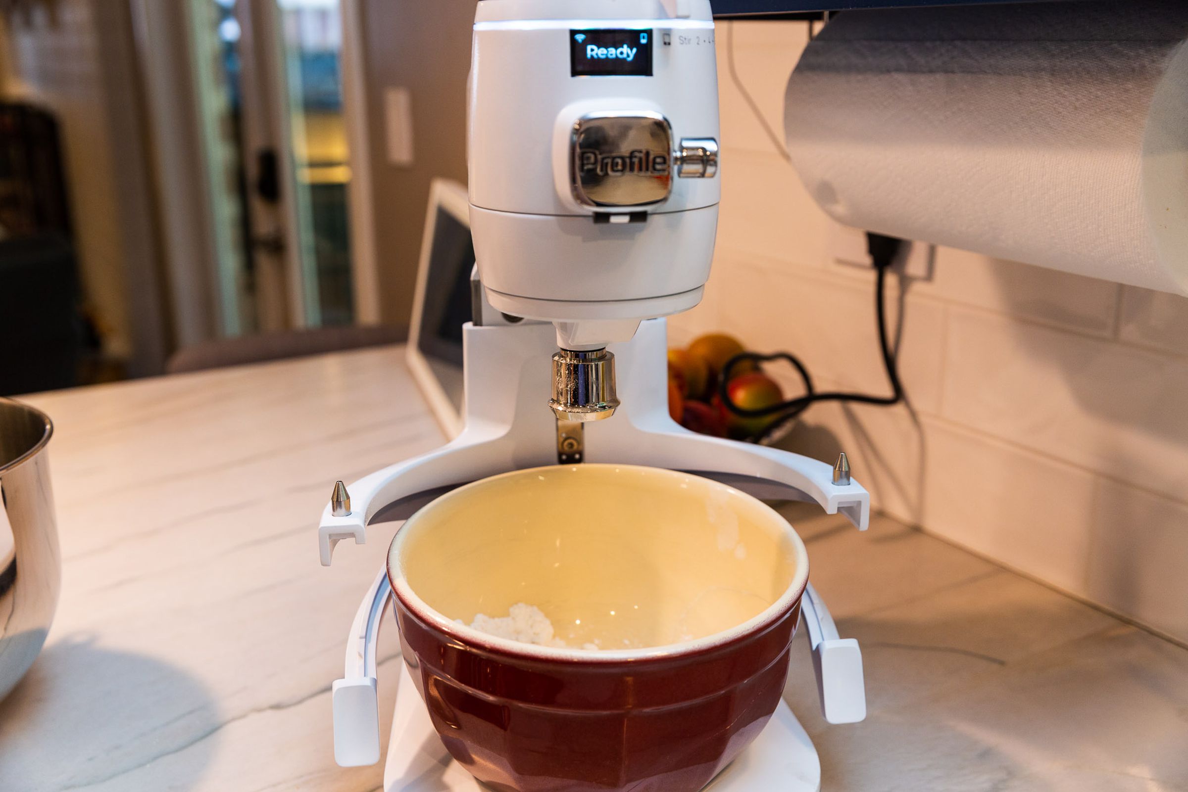 The mixer's base is a scale, so you can use any bowl to measure ingredients.