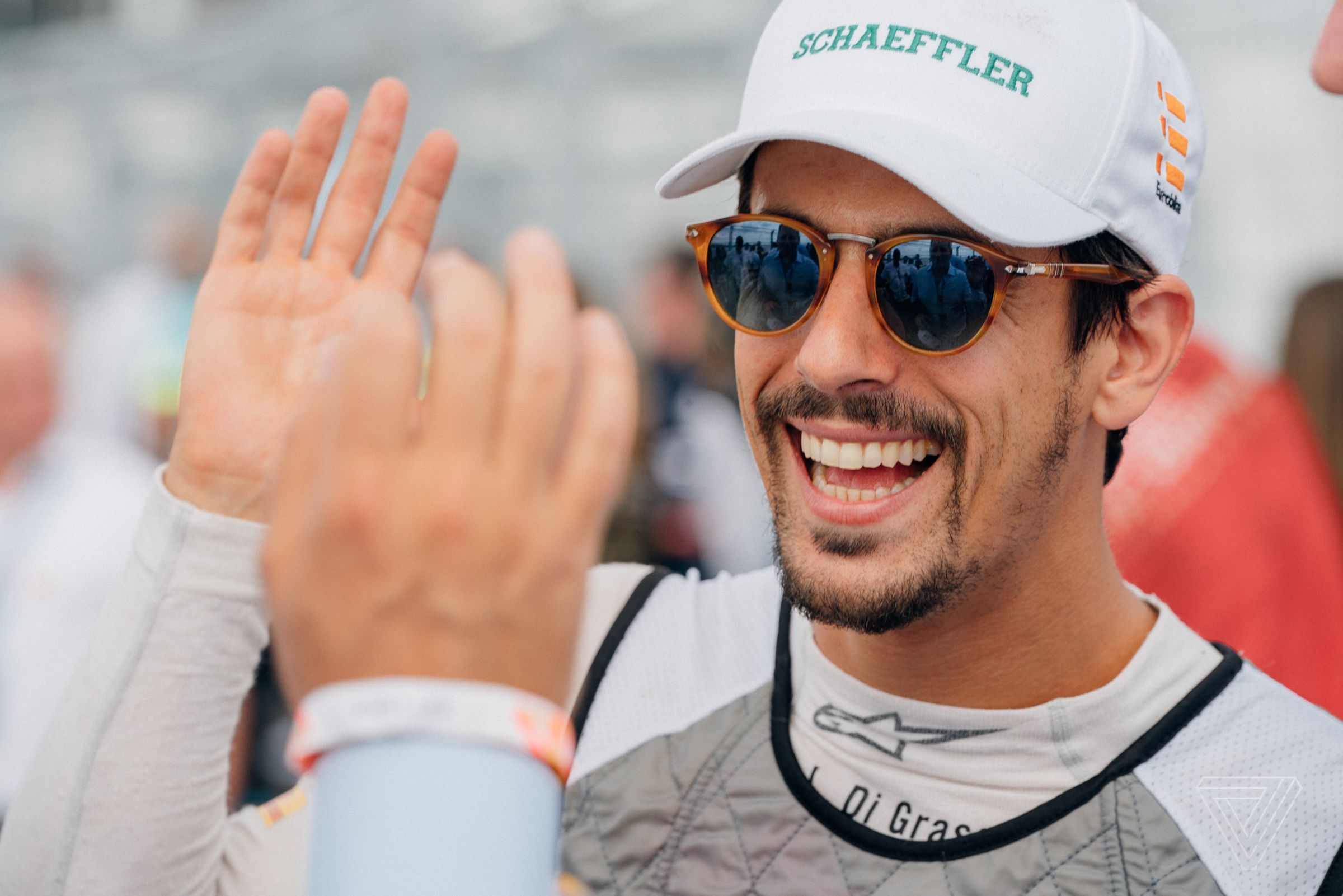 Audi driver Lucas di Grassi gets a high five before hopping into his car. He came into the weekend second in the championship hunt. 