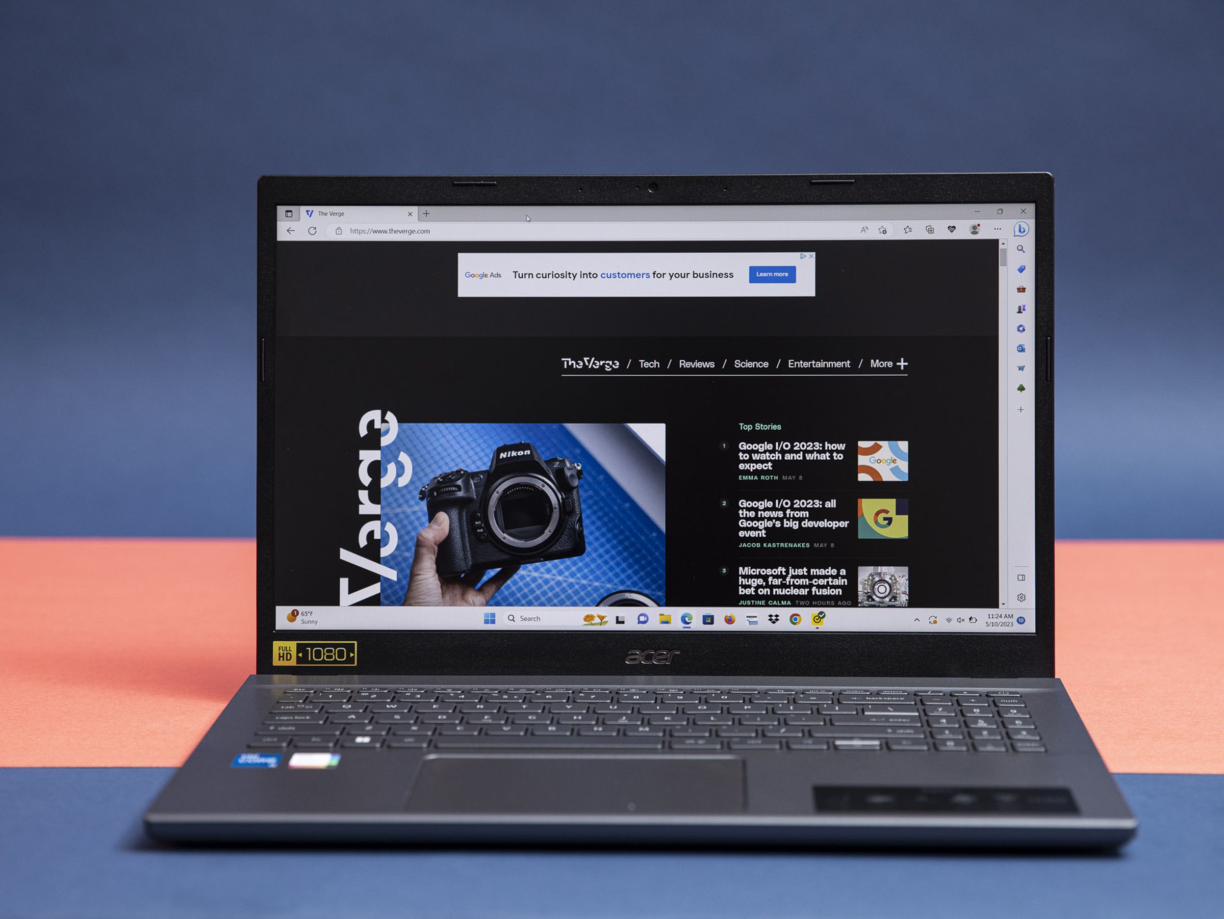 The Acer Aspire 5 displaying The Verge homepage.