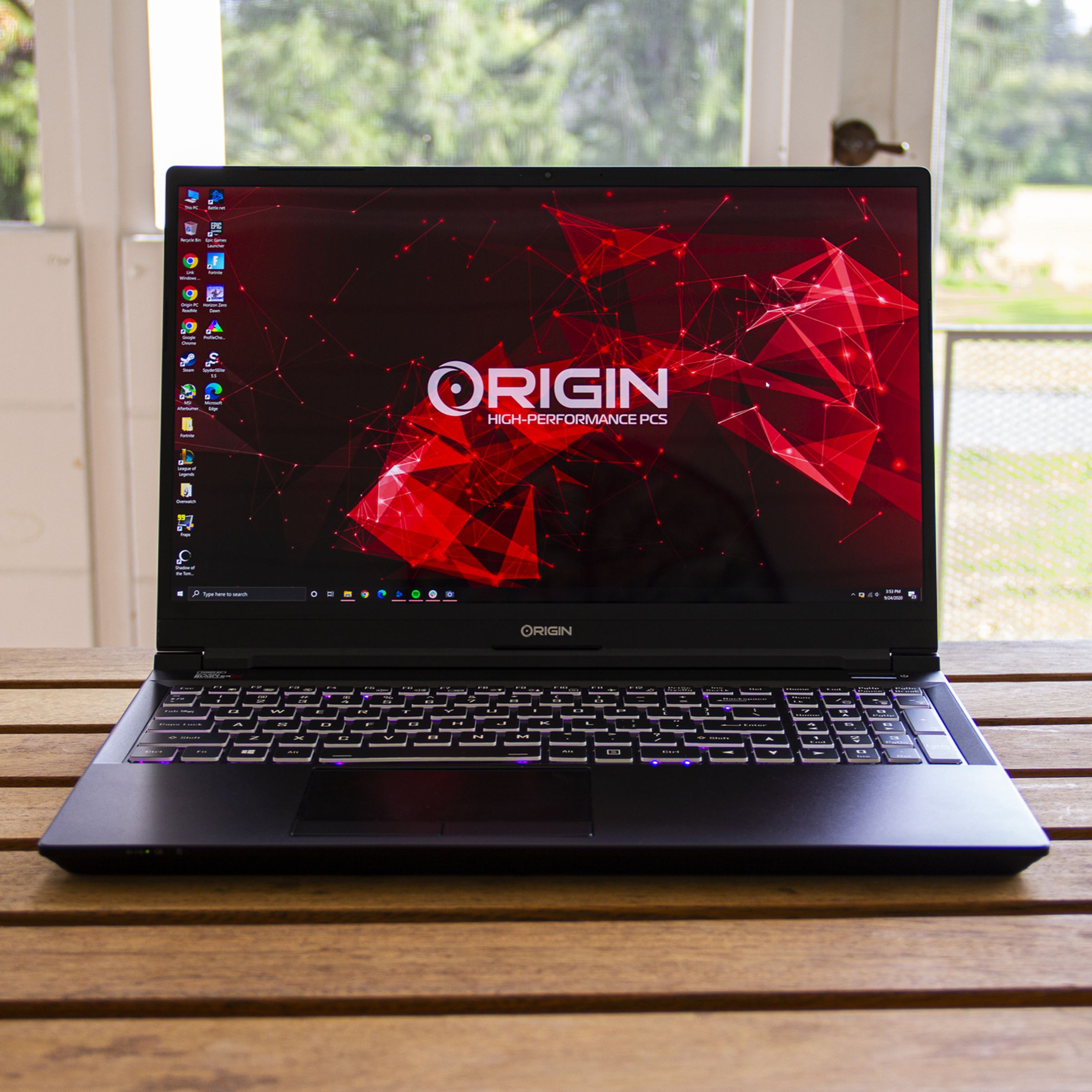 The Origin EVO15-S sits on a porch table.