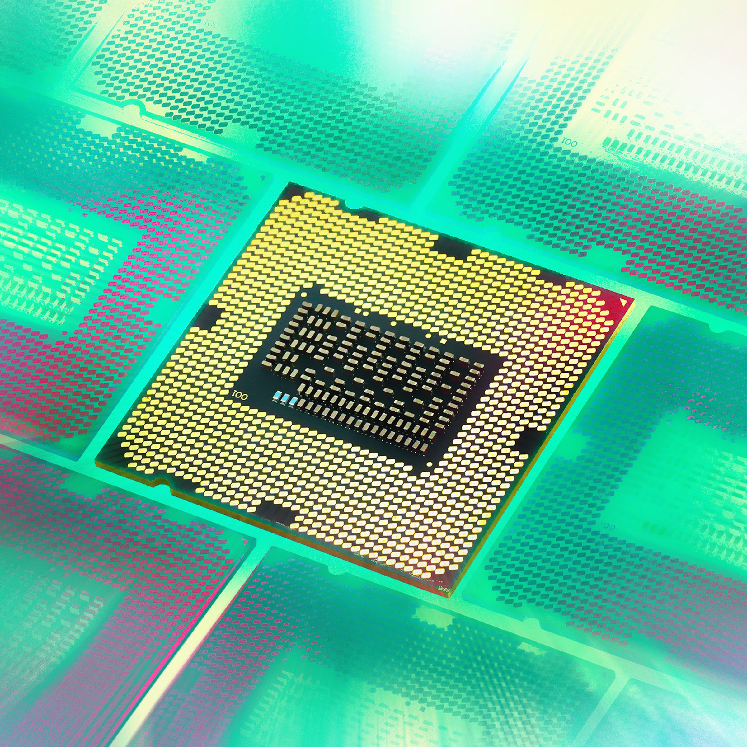 Illustrations of a grid of processors seen at an angle with the middle one flipped over to show the pins and the rest shrouded in a green aura