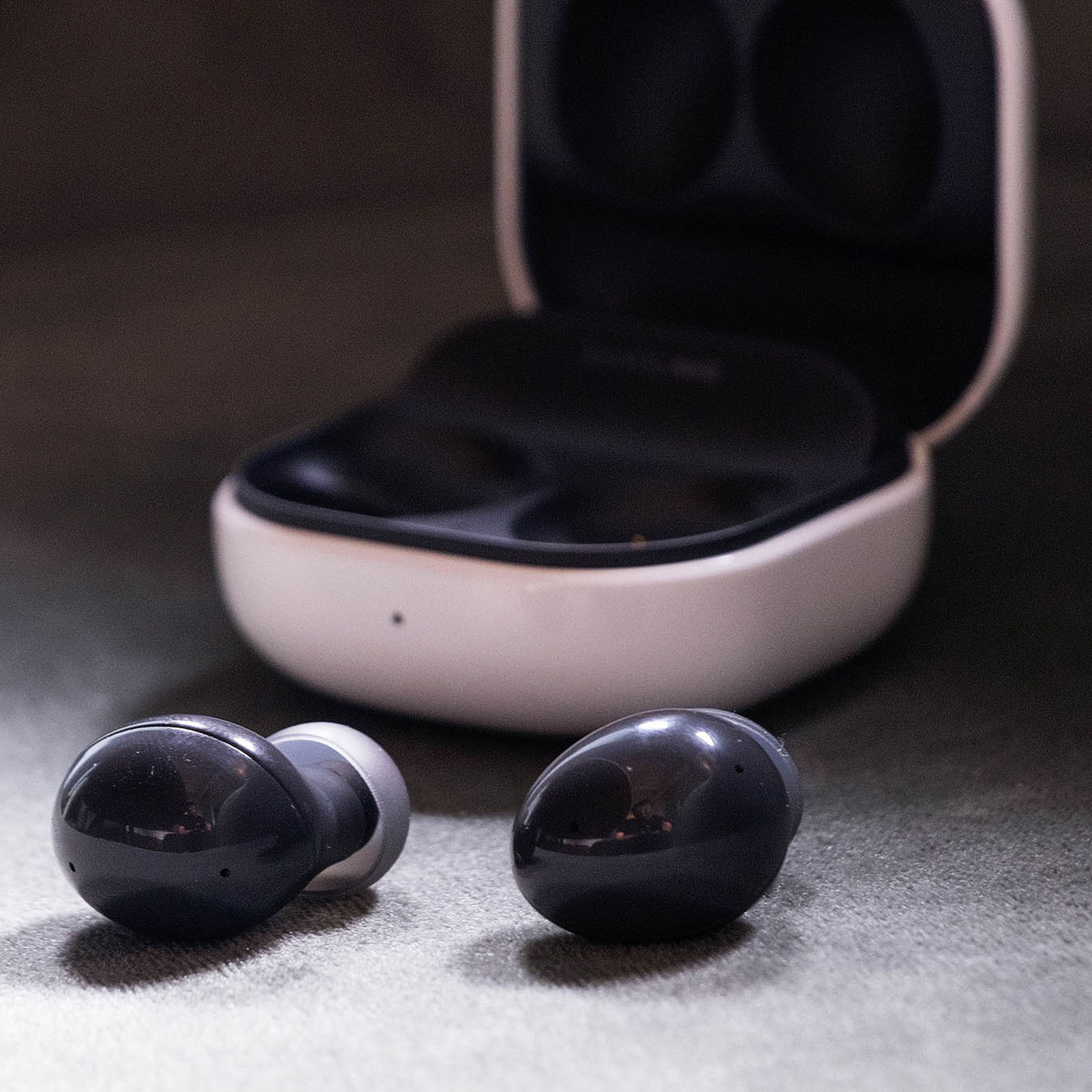 The Samsung Galaxy Buds 2 sitting outside their case.