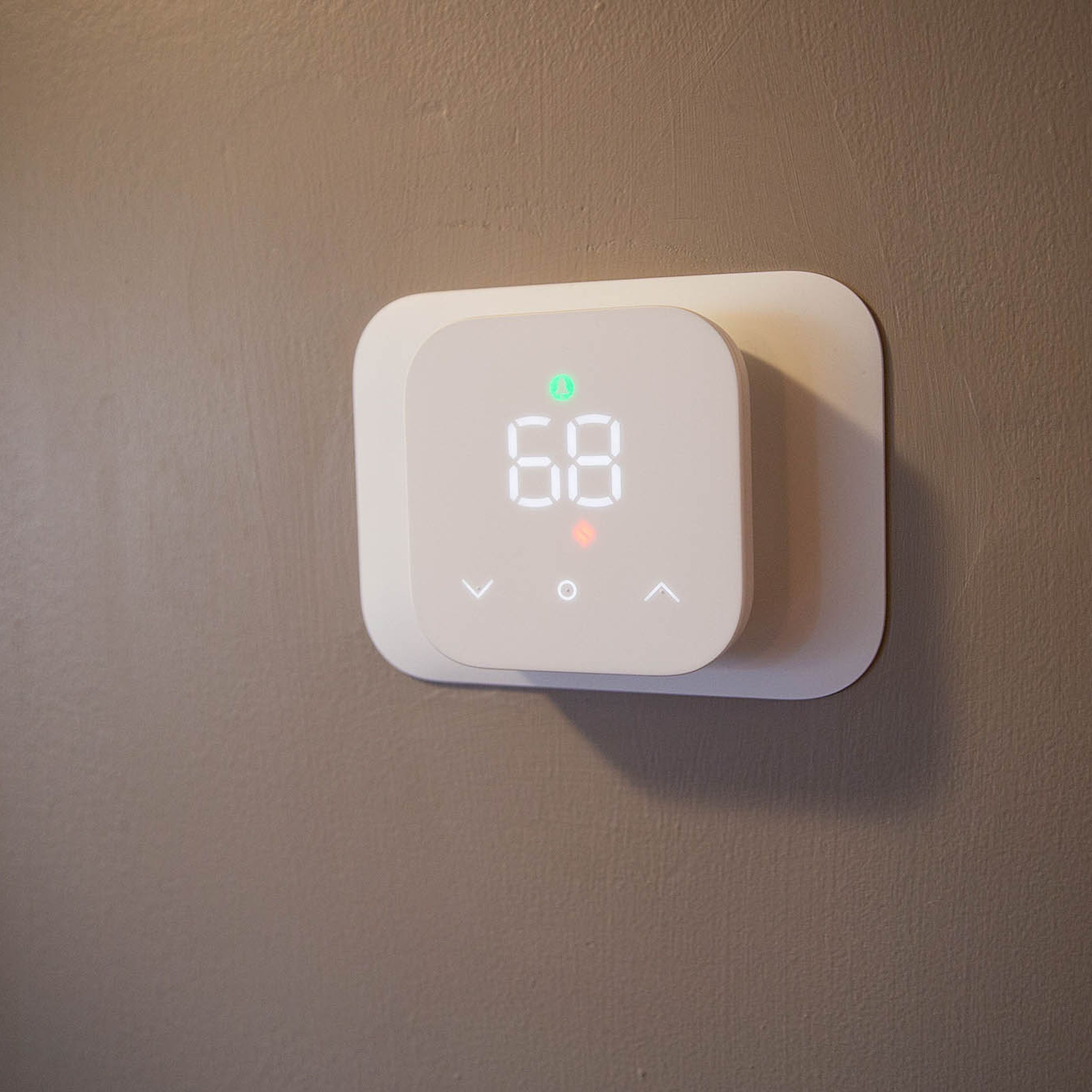 The Amazon Smart Thermostat mounted to a wall.