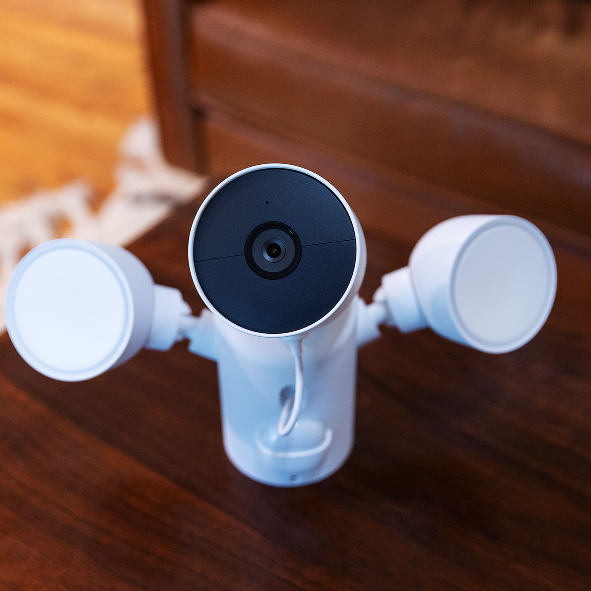 The Google Nest Cam with floodlight sitting on a table before installation.