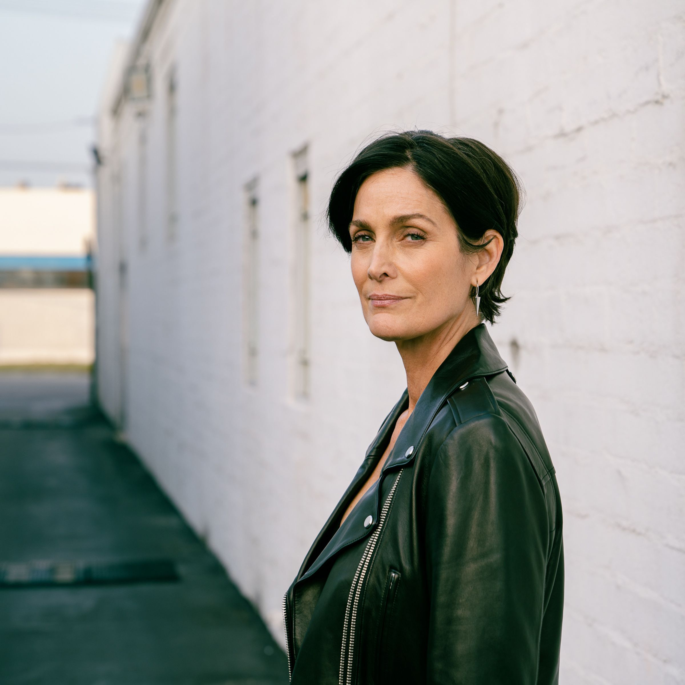 A photo of Carrie-Anne Moss.