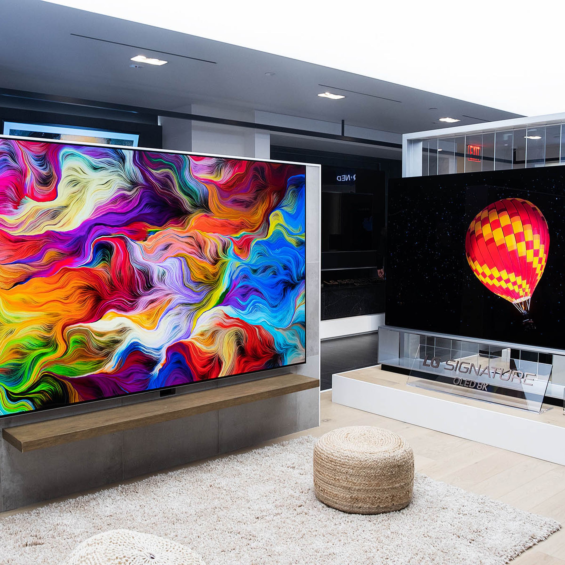 A picture of two wall-mounted LG TVs taken during CES 2022.