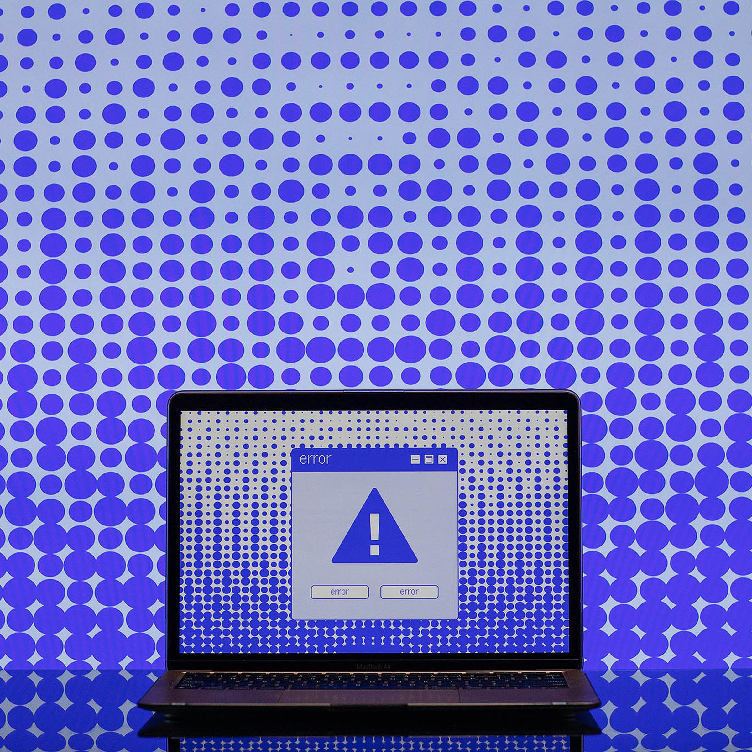 Illustration of a computer screen with a blue exclamation point on it, and an error box.