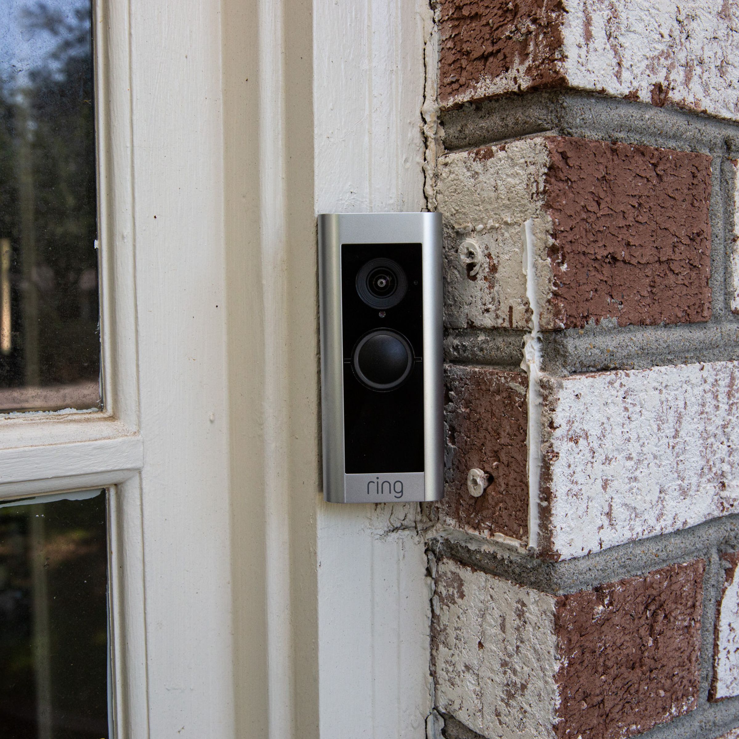 A Ring Video Doorbell Pro 2 mounted outside the front door of a house.