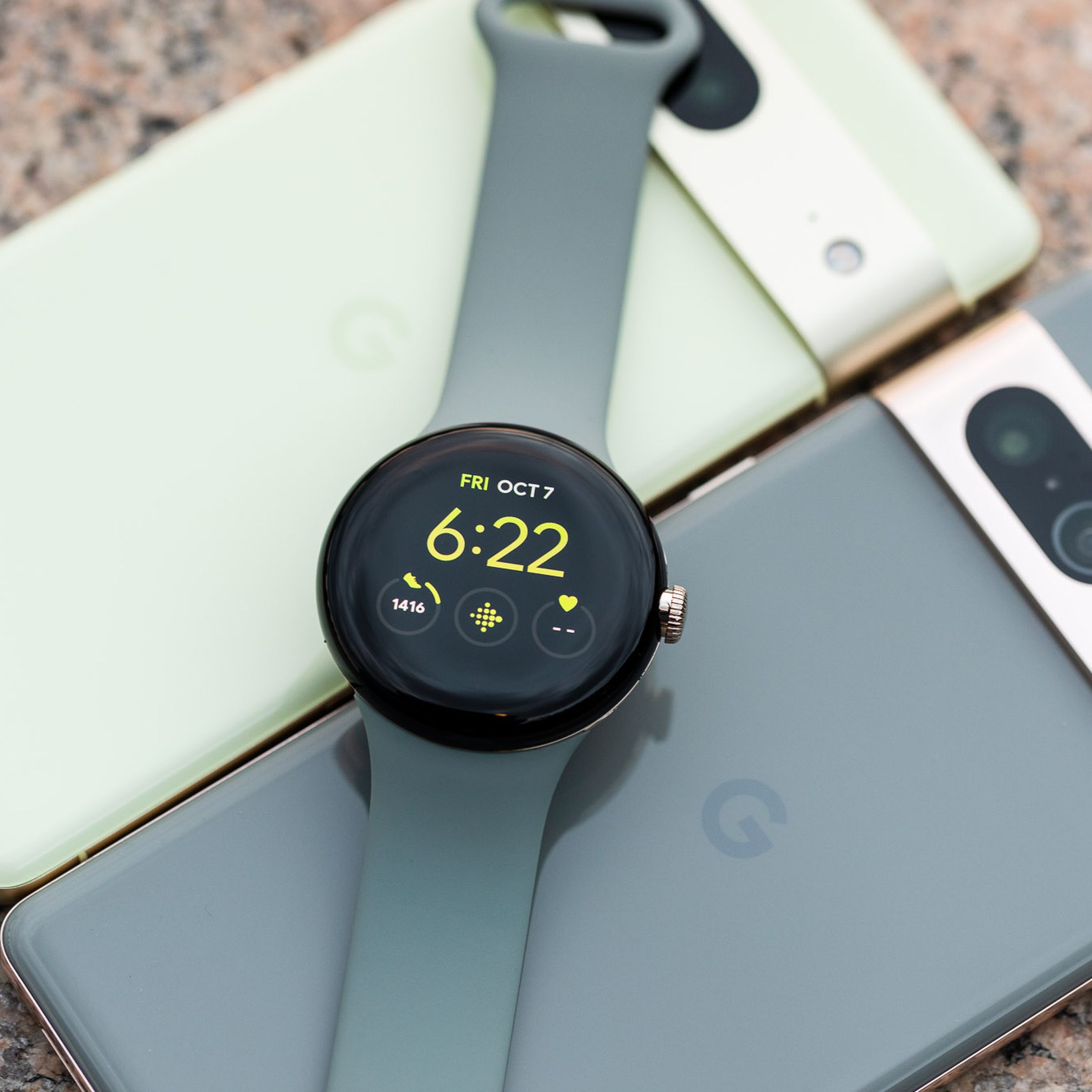 Pixel Watch on top of a Pixel 7 and Pixel 7 Pro