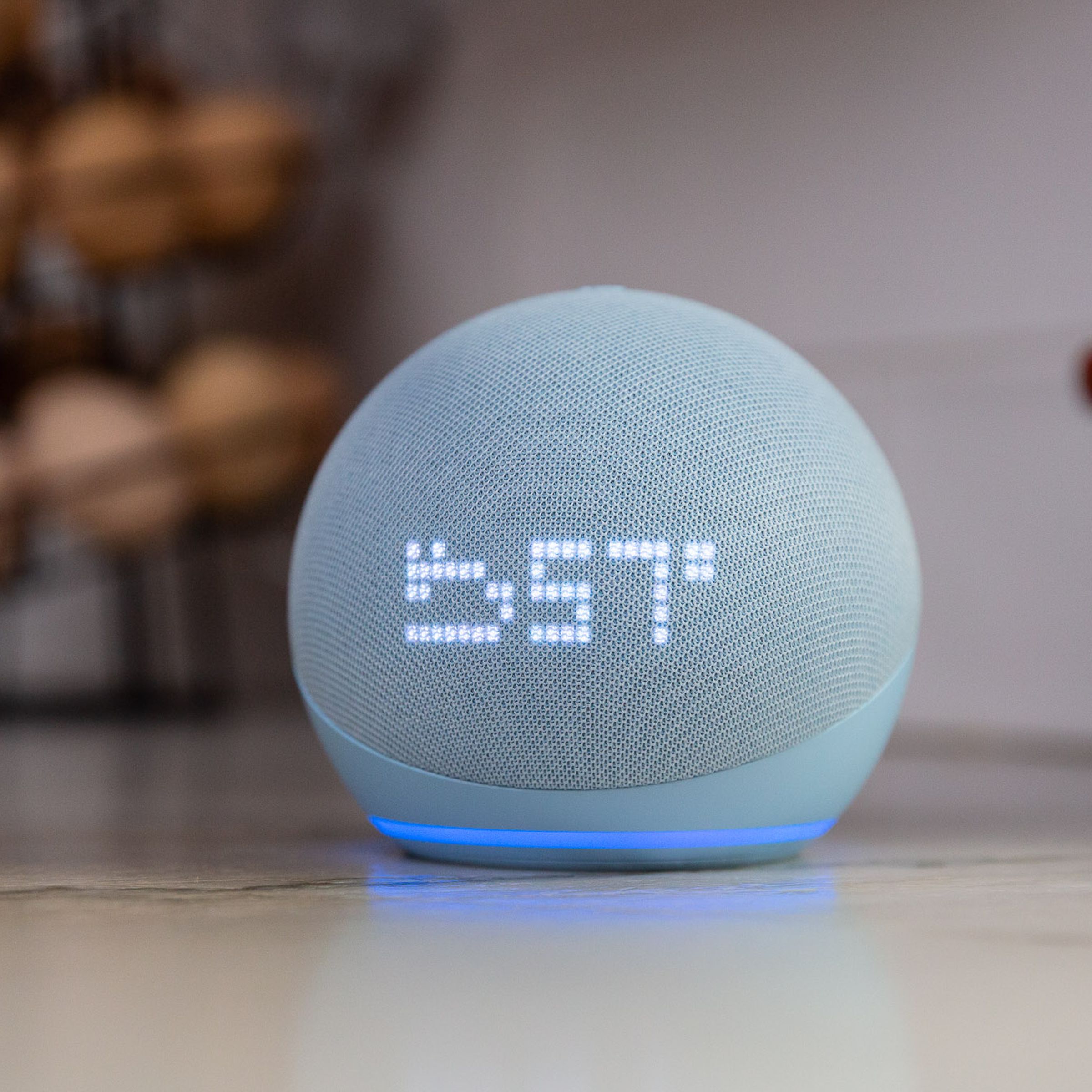 An Echo Dot with Clock on a kitchen counter