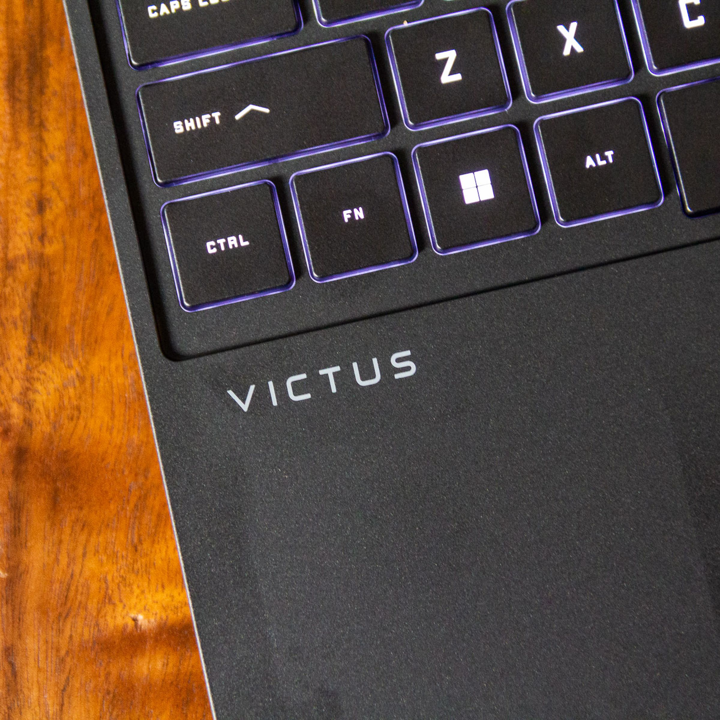 The Victus logo on the keyboard deck of the HP Victus 15.