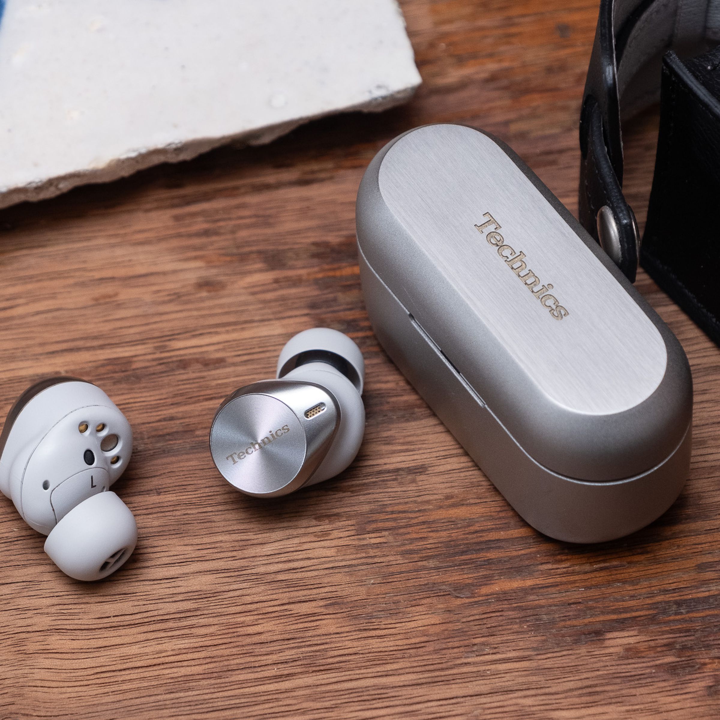 A photo of the Technics EAH-AZ80 earbuds.