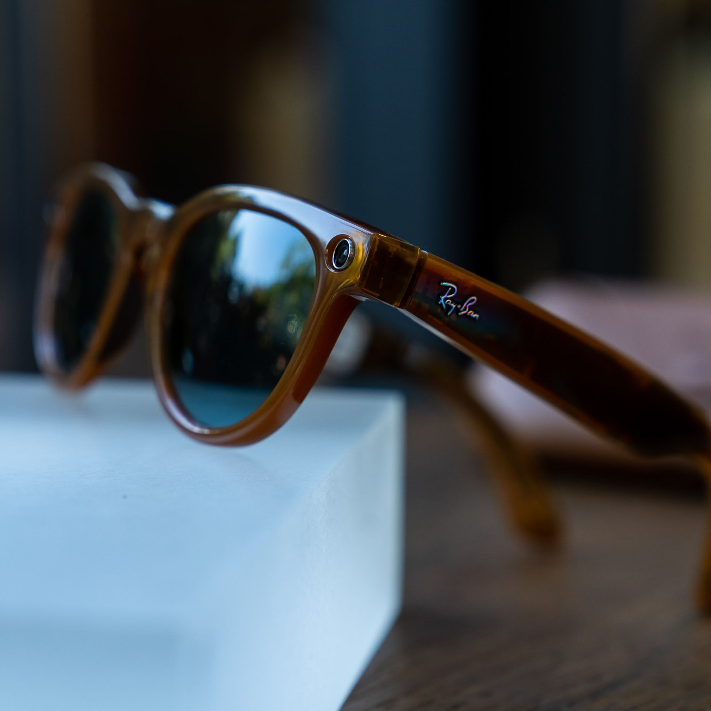 Ray-Ban Meta Smart Glasses propped up on a glass block